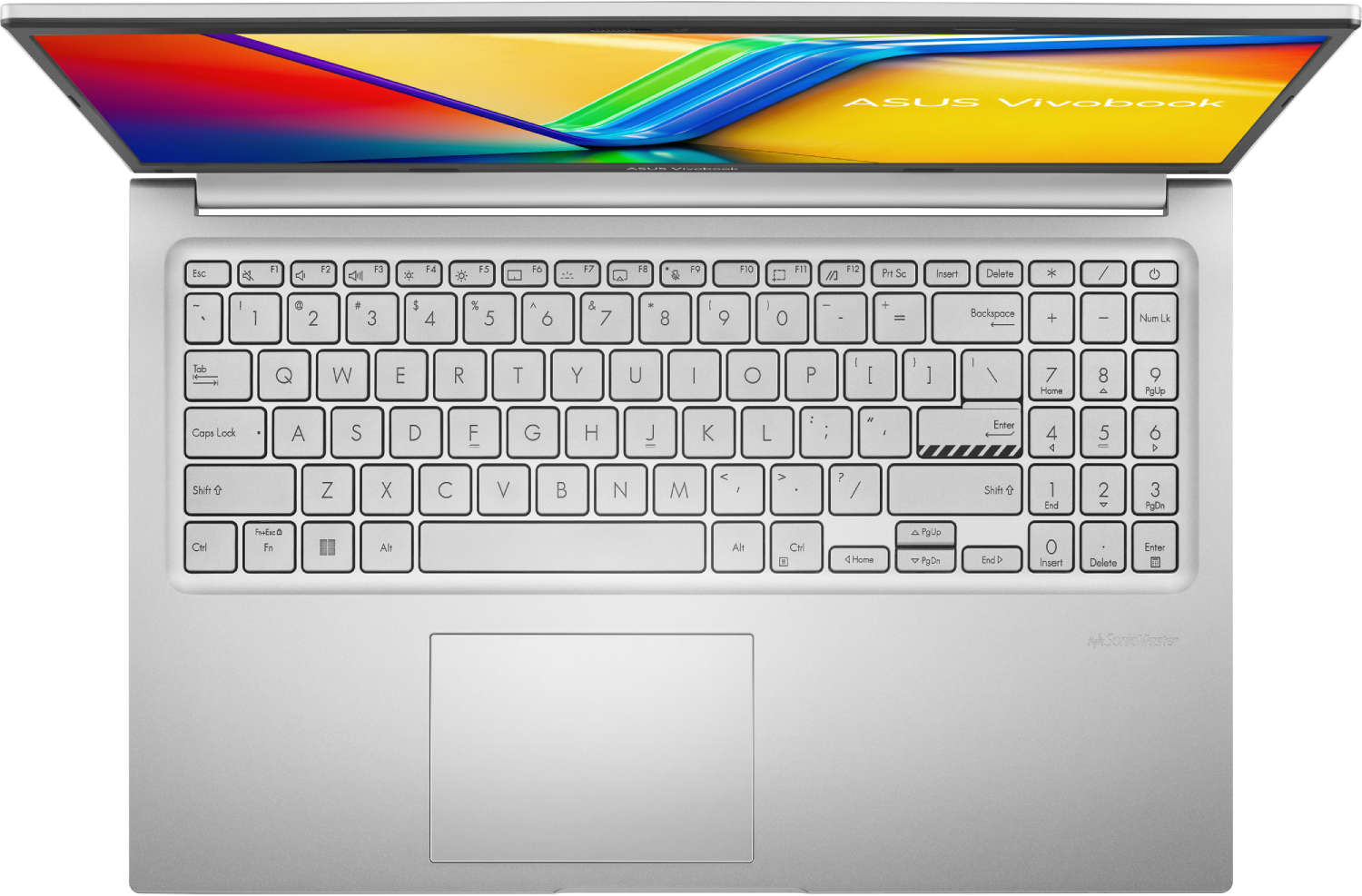 Un portátil abierto con cuerpo plateado. El teclado es visible con teclas y panel táctil. La pantalla muestra gráficos coloridos.