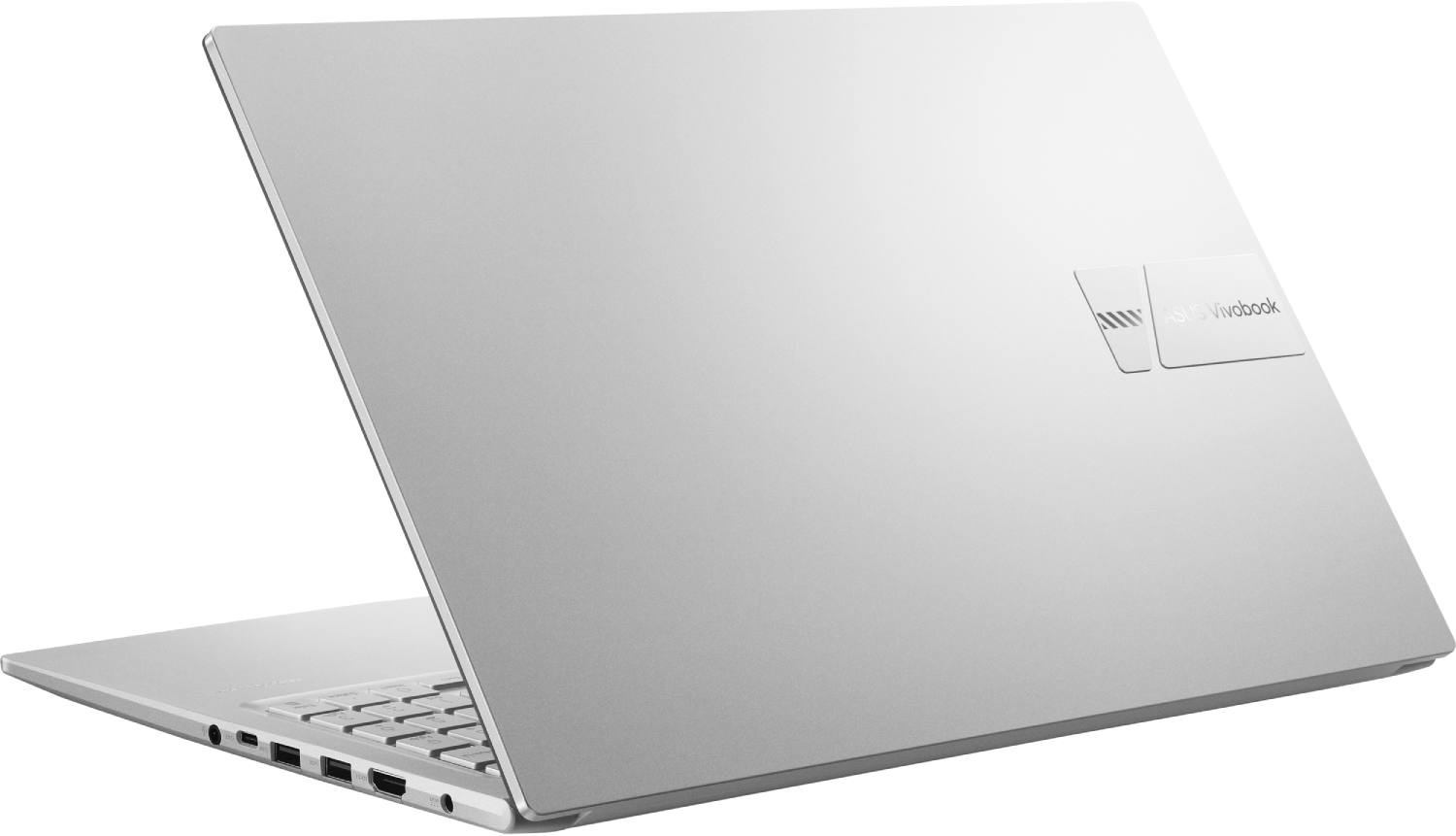 Portátil plateado sobre fondo blanco. La tapa del portátil está abierta, mostrando el teclado. El logotipo ASUS Vivobook es visible.
