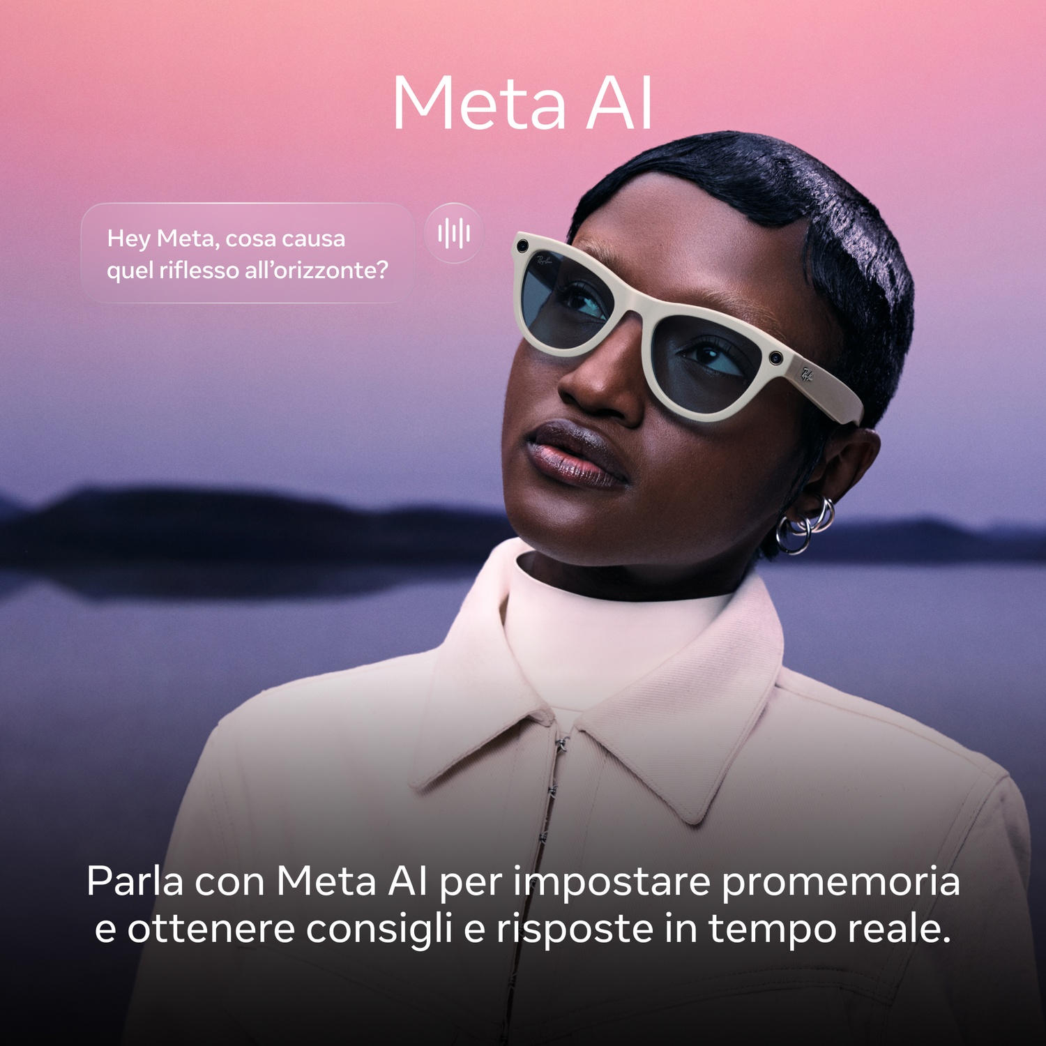 Una persona con occhiali da sole guarda in alto. Il testo dice 'Hey Meta' e 'Meta AI'. Lo sfondo mostra un lago e un cielo sfumato.