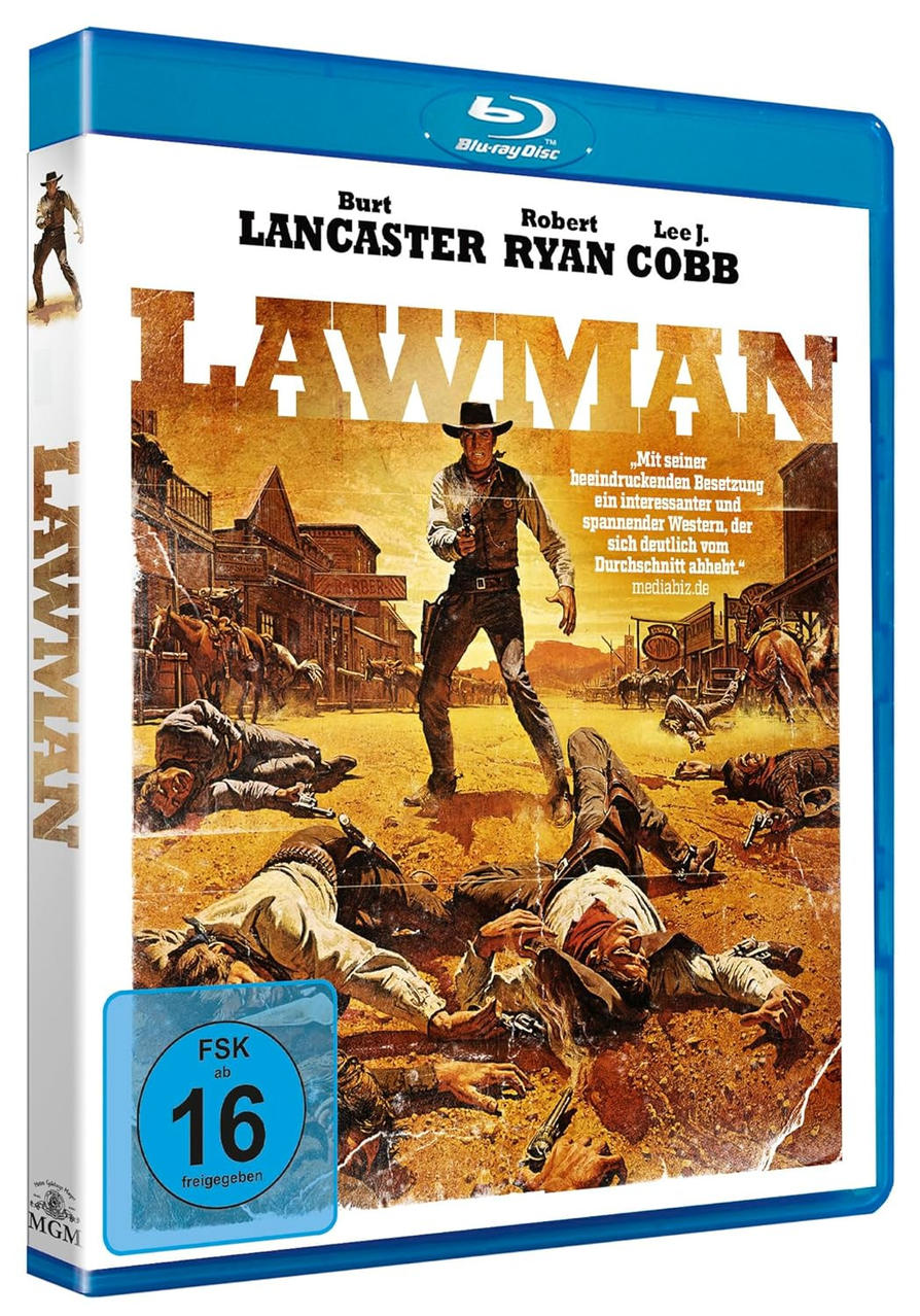 Filmcover von Lawman. Ein Cowboy zielt mit einer Waffe auf den Betrachter. Tote Männer liegen am Boden. Gebäude und Pferde im Hintergrund.