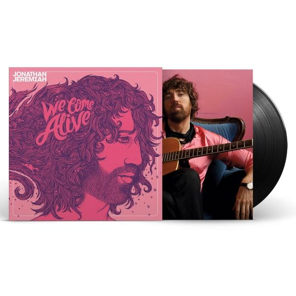 Albumcover und Schallplatte. Cover zeigt Mann mit Locken. Der Mann hält Gitarre. Pinker Hintergrund.