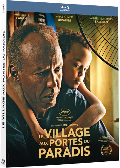 Affiche de film : Un homme tient un enfant. Le texte dit 'Le Village aux Portes du Paradis'. Le logo du Festival de Cannes est visible.