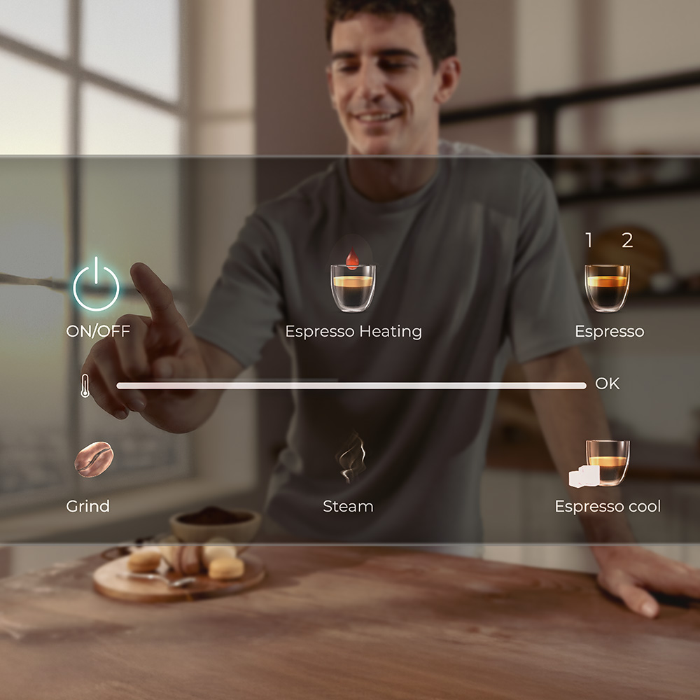 Un hombre opera una interfaz de máquina de café. Se muestran iconos de encendido/apagado, calentamiento, molienda, vapor y espresso. Se muestran tazas de espresso.