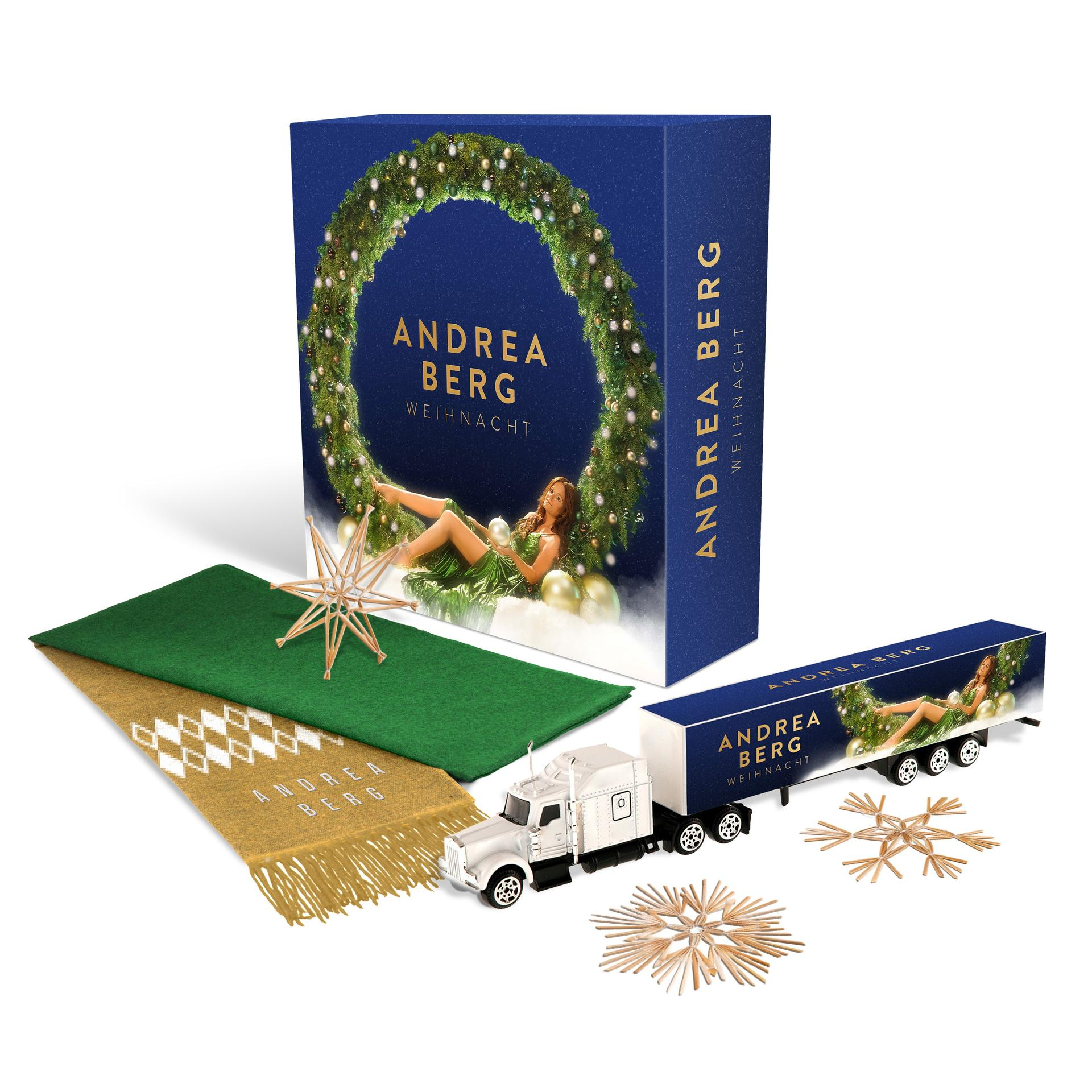 Weihnachtsausstellung mit Box, LKW, Stern und Läufer. Sie tragen den Namen Andrea Berg. Eine Frau ist auf der Box.