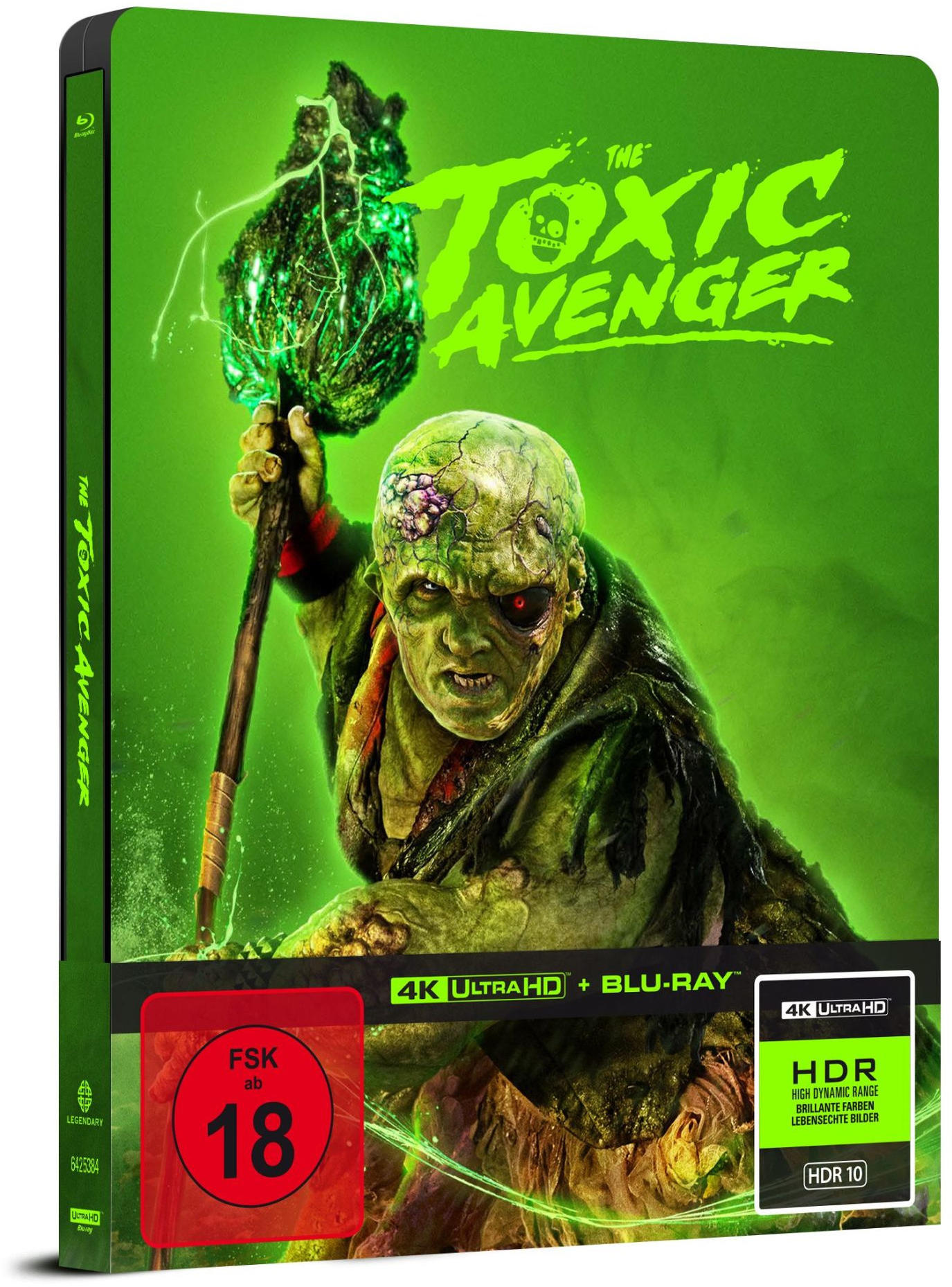 Blu-ray-Cover für 'The Toxic Avenger'. Eine groteske Figur hält einen leuchtend grünen Gegenstand. Grüner und roter Text mit Altersfreigabe 18.