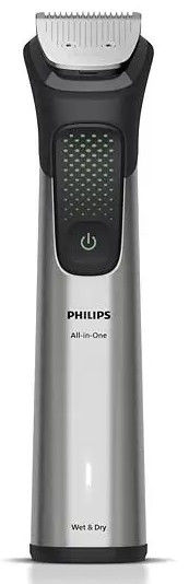 Trymer Philips All-in-One. Jest srebrny i czarny. Głowica trymera jest widoczna na górze. Przycisk zasilania znajduje się z przodu.