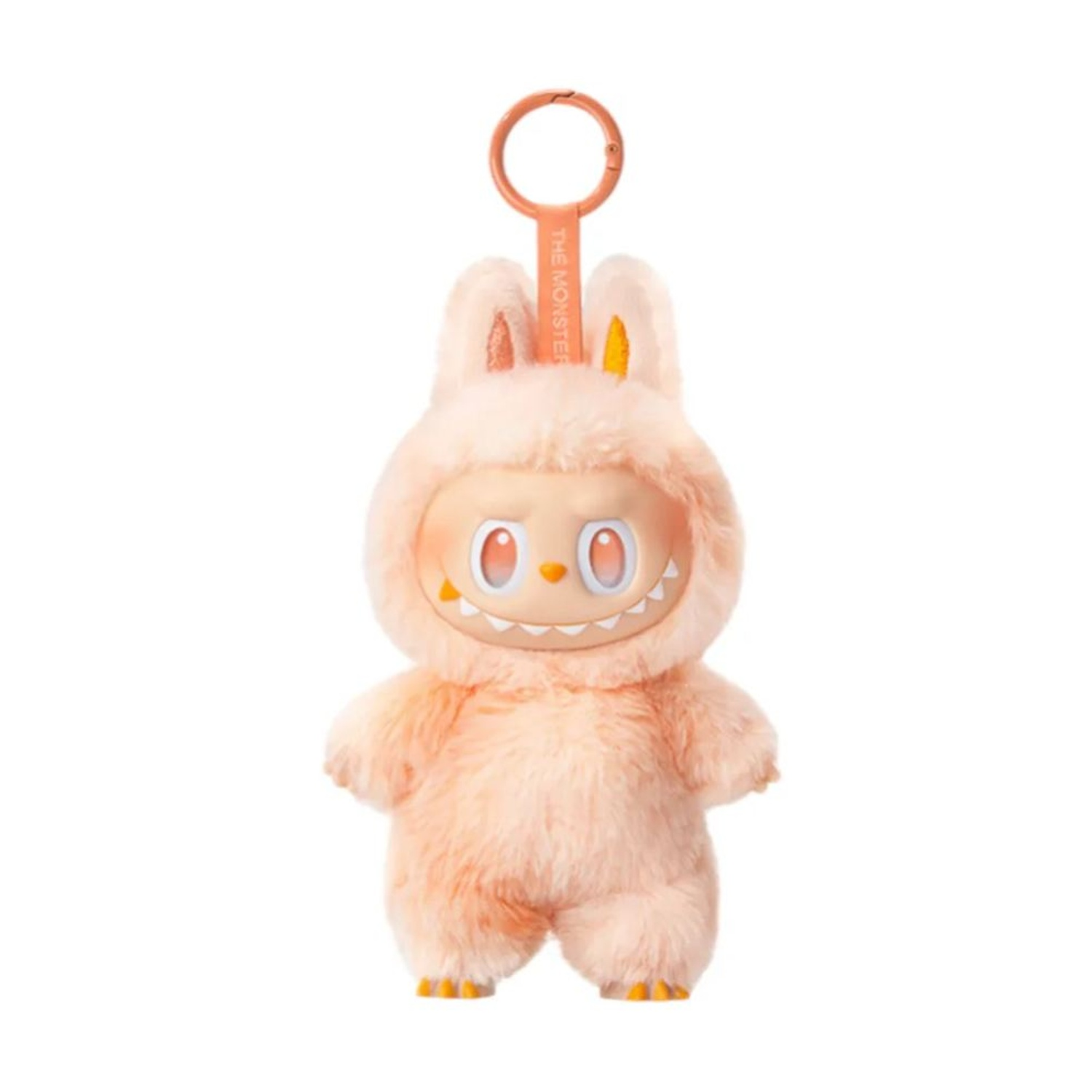 Un peluche in costume da coniglio con dettagli arancioni. Ha un portachiavi, un volto sorridente e una consistenza soffice. Sfondo arancione e bianco.