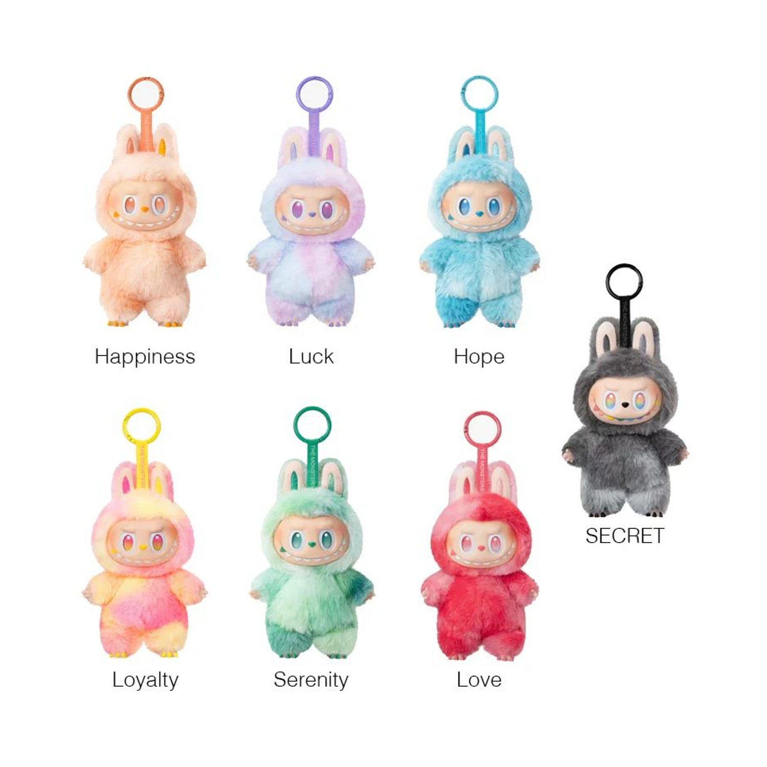 Sette peluche in costume da coniglio di vari colori. Ognuno ha un portachiavi e una faccia sorridente. Etichette: Felicità, Fortuna, Speranza, Lealtà, Serenità, Amore, Segreto.