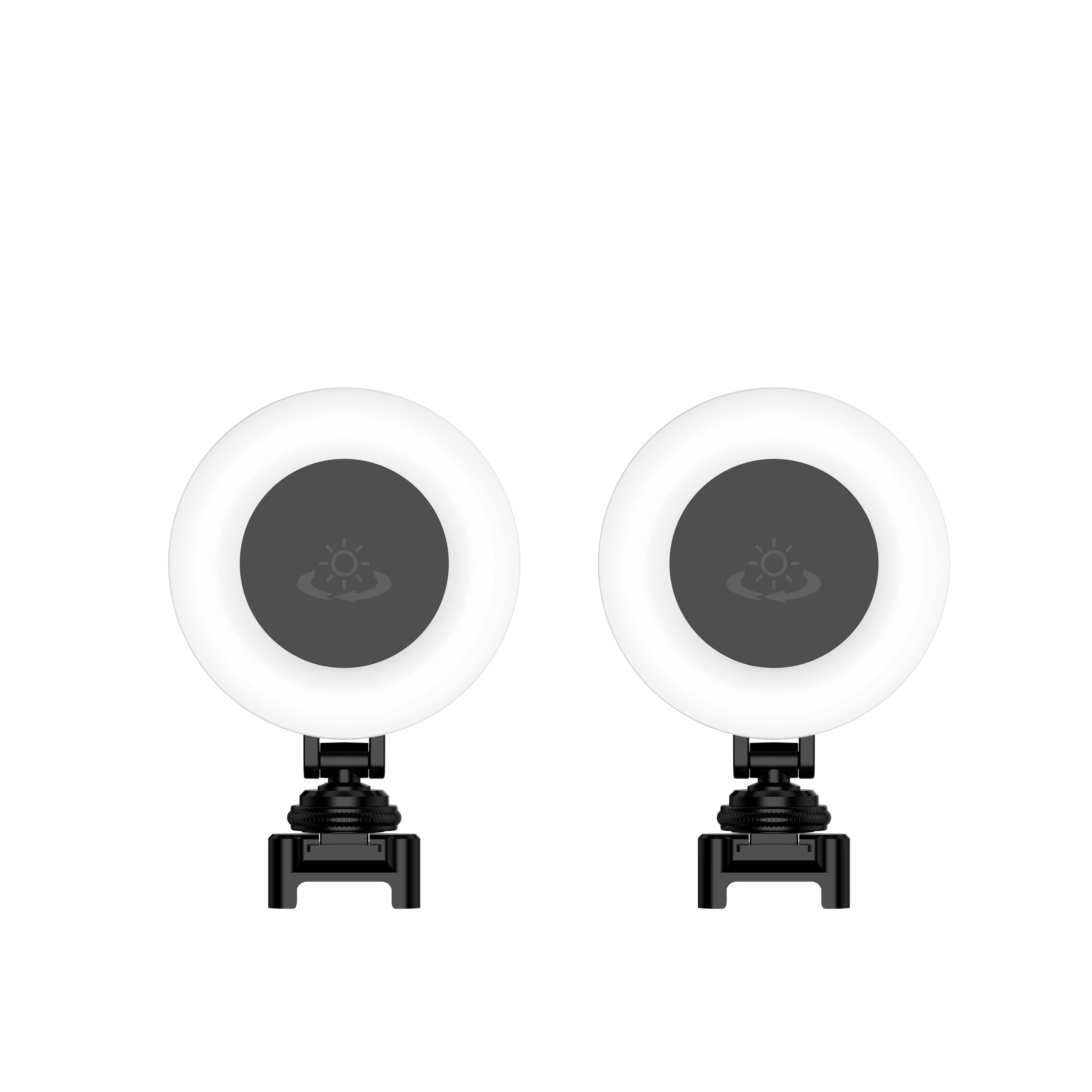 Zwei Ringlichter sind vorhanden. Jedes hat einen weißen Ring und eine dunkle Mitte mit einem Sonnensymbol, montiert auf schwarzen Ständern.