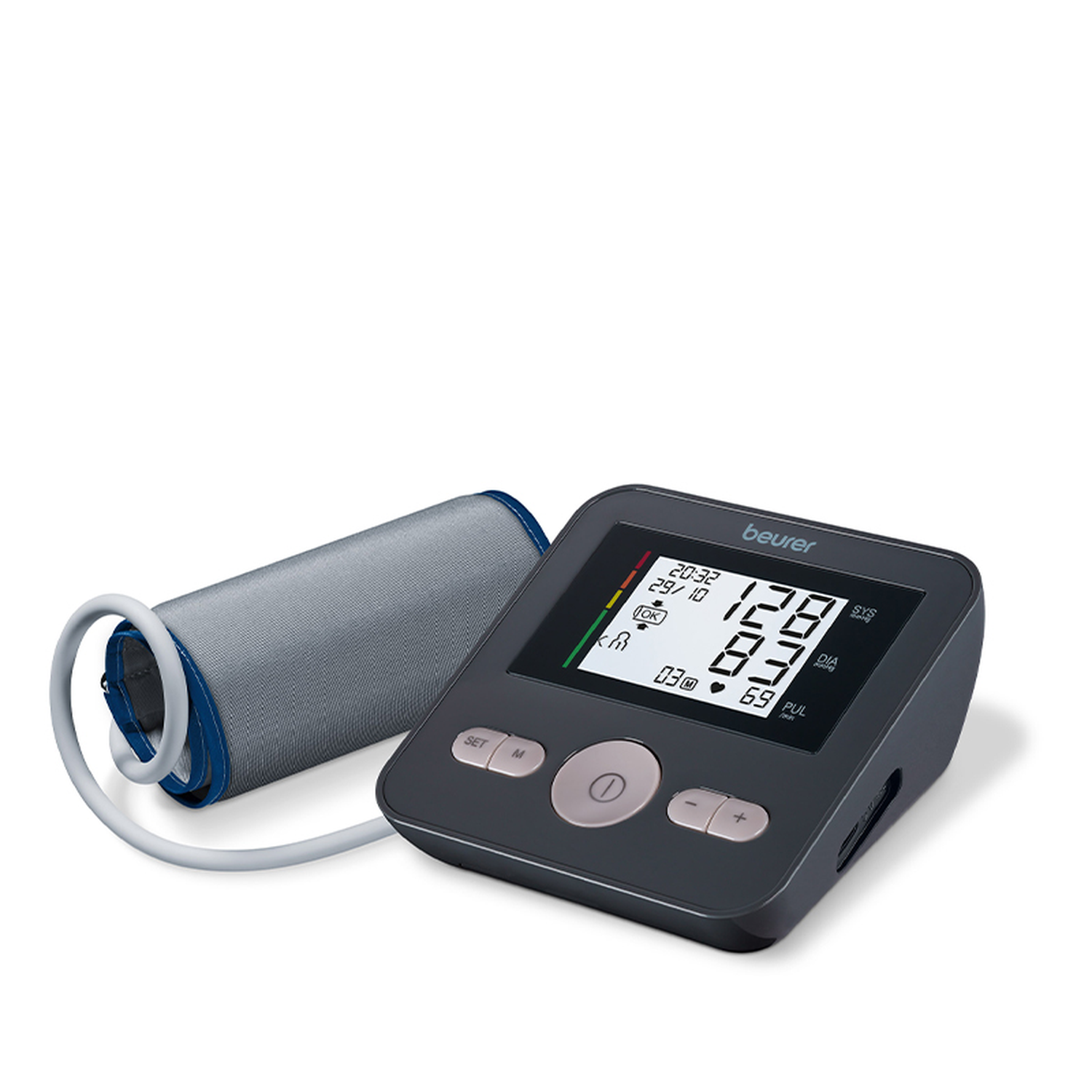 A digital blood pressure monitor. It has a display showing readings and a connected cuff. The brand name 'beurer' is visible.