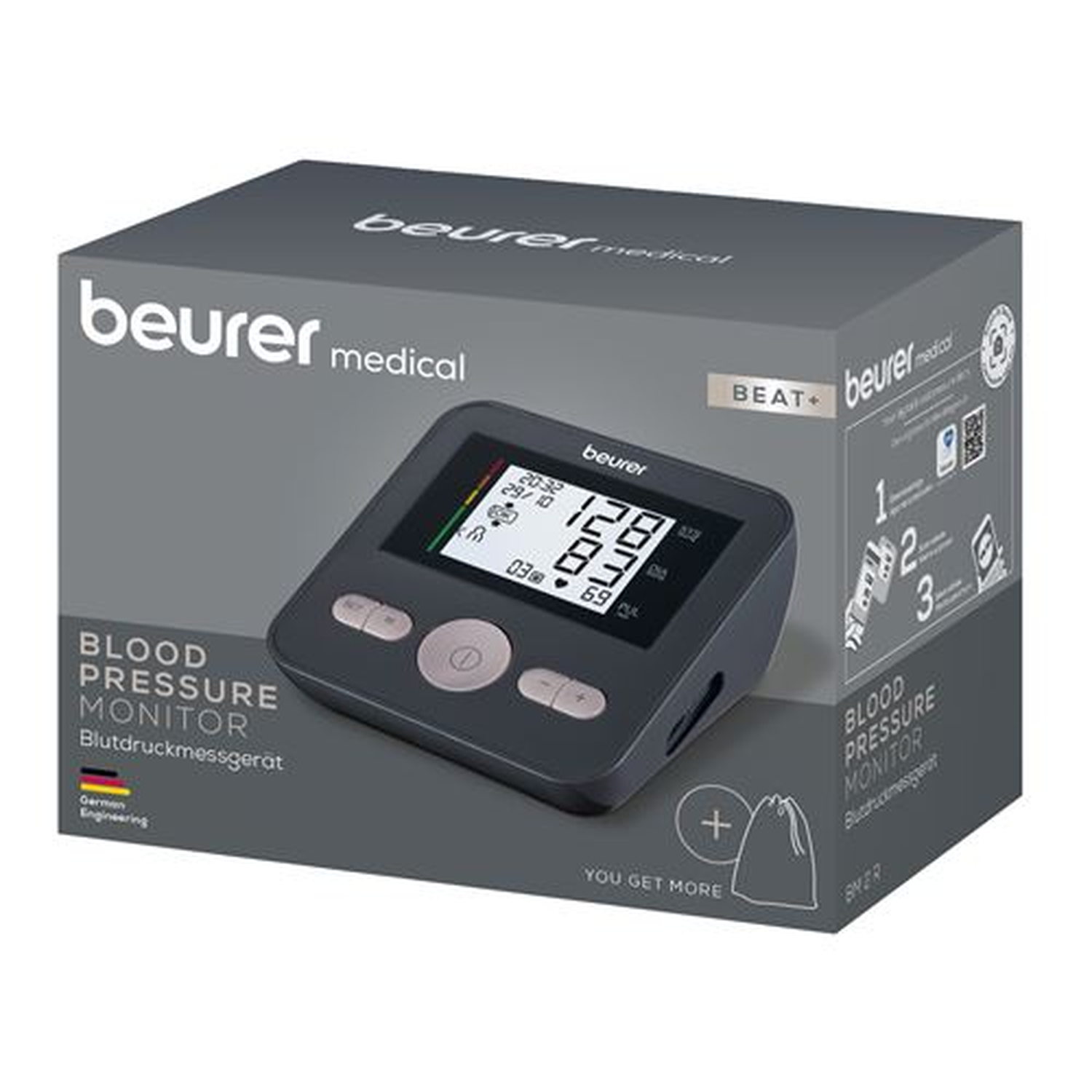 A blood pressure monitor in its box. The monitor displays readings. The box is gray with the brand name and product details.