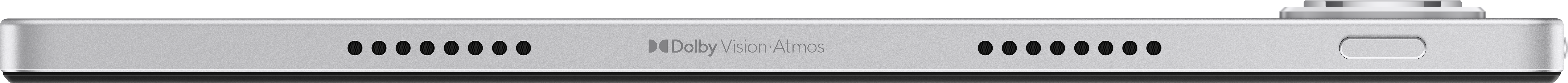 Srebrne urządzenie z czarnymi otworami głośnikowymi, logo Dolby Vision Atmos i portem. Czarne tło.