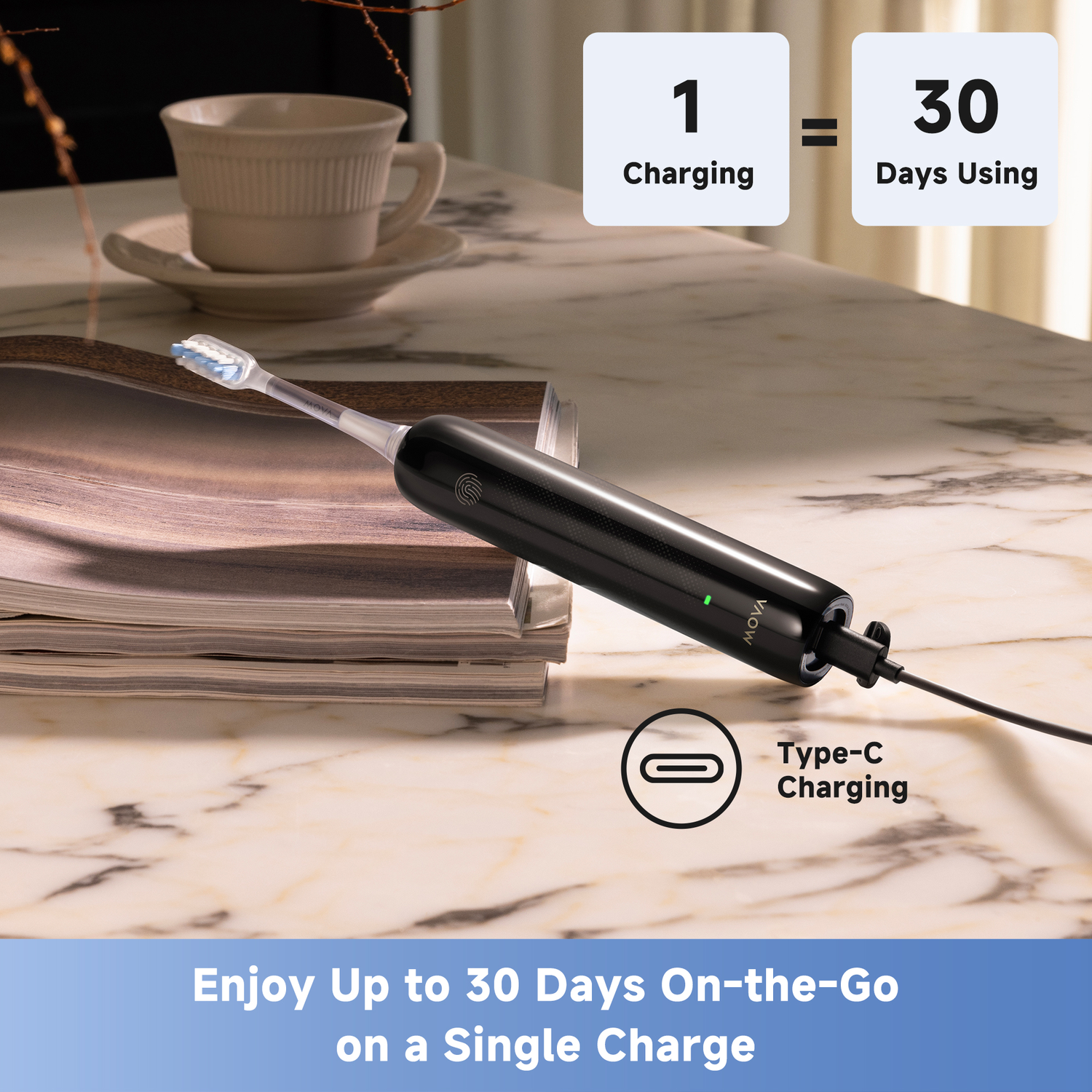 Black electric toothbrush on a marble surface, with text indicating 1 charge lasts 30 days. A cup and magazines are in the background.