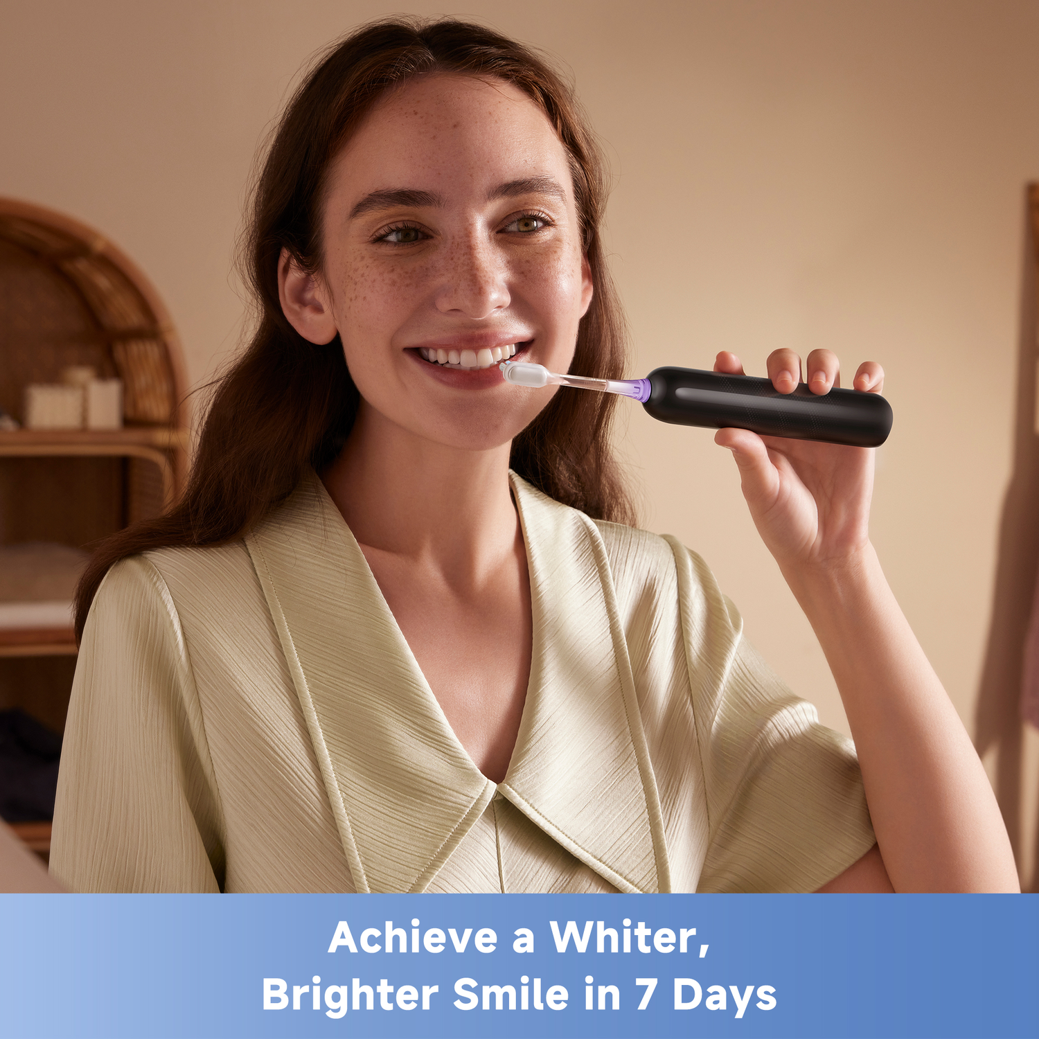 Woman smiles while brushing teeth with a black electric toothbrush. Text on bottom reads: Achieve a Whiter, Brighter Smile in 7 Days.
