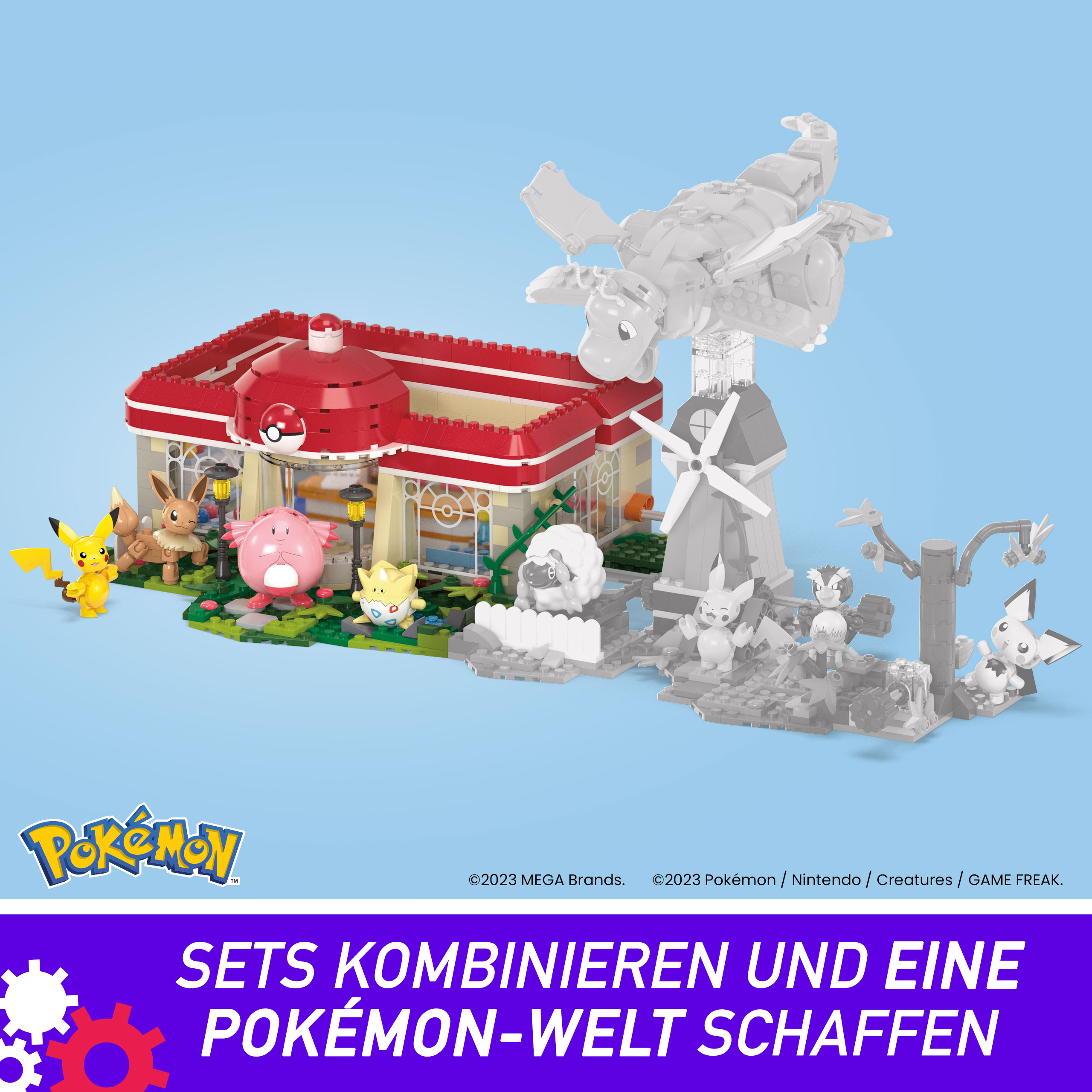 Ein Pokémon-Spielzeug-Set mit verschiedenen Figuren. Ein Gebäude und eine Windmühle sind zu sehen. Der Hintergrund ist hellblau.