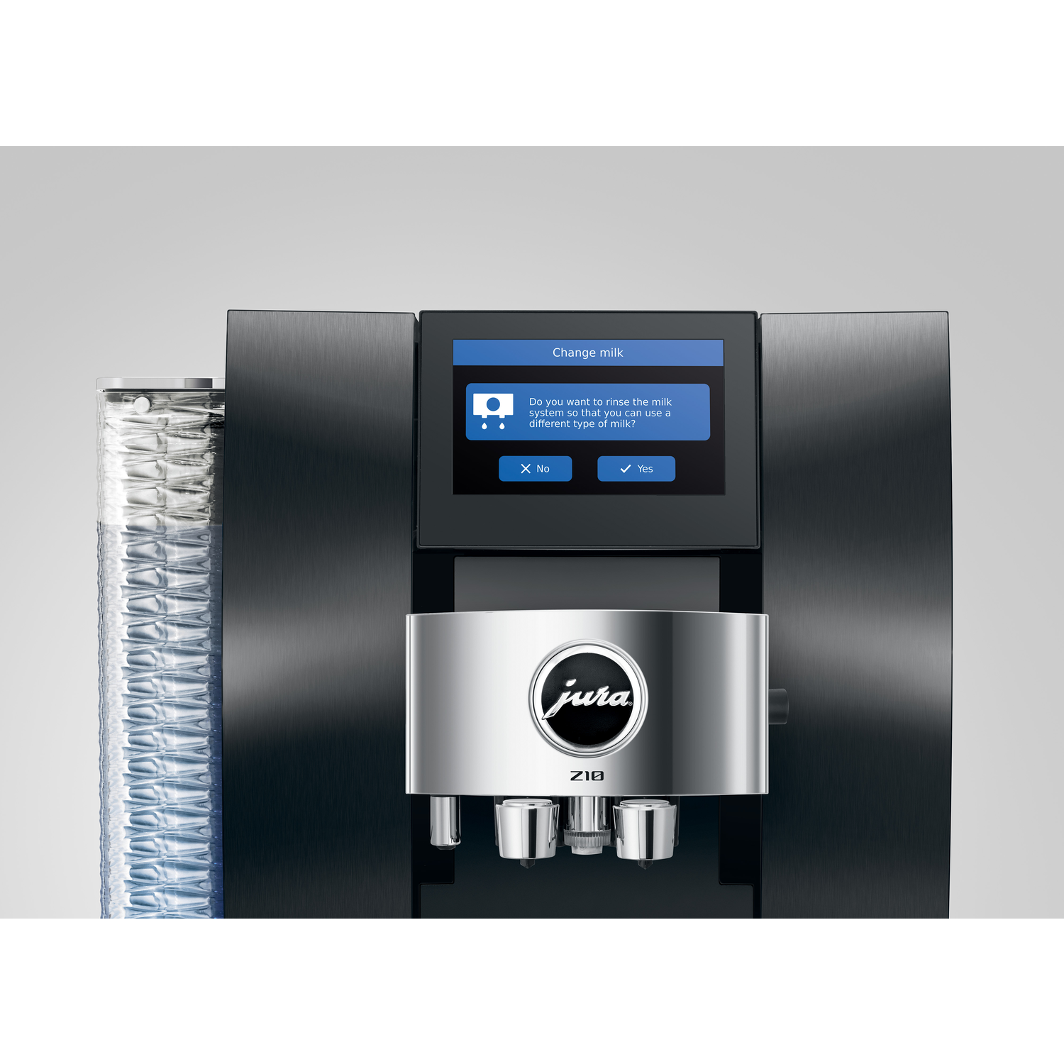 A black and silver Jura Z10 coffee machine. The screen shows a prompt to rinse the milk system. The background is white.