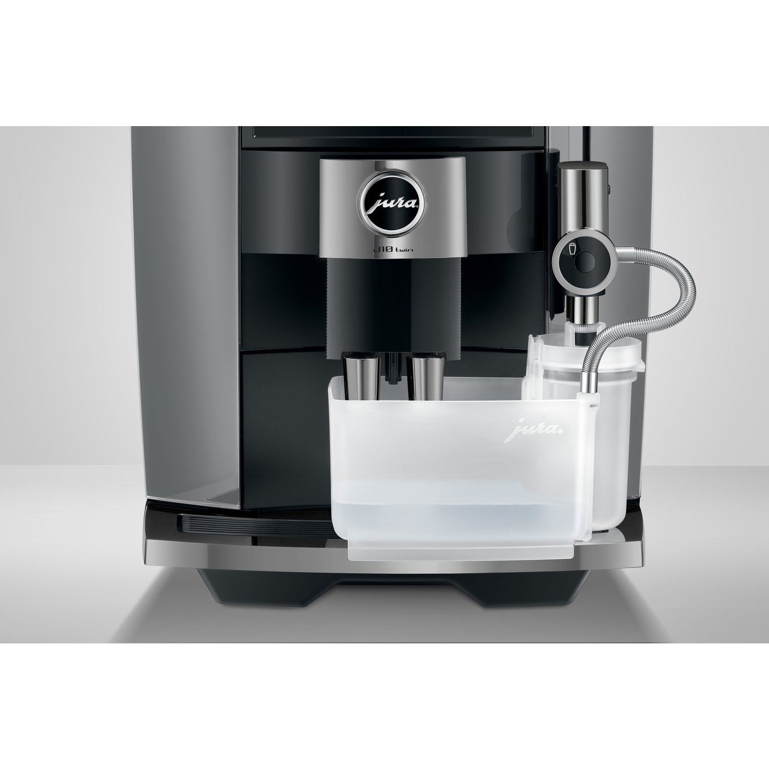 A modern Jura coffee machine. Features a water reservoir, a spout, and a brand logo. Silver and black color scheme.