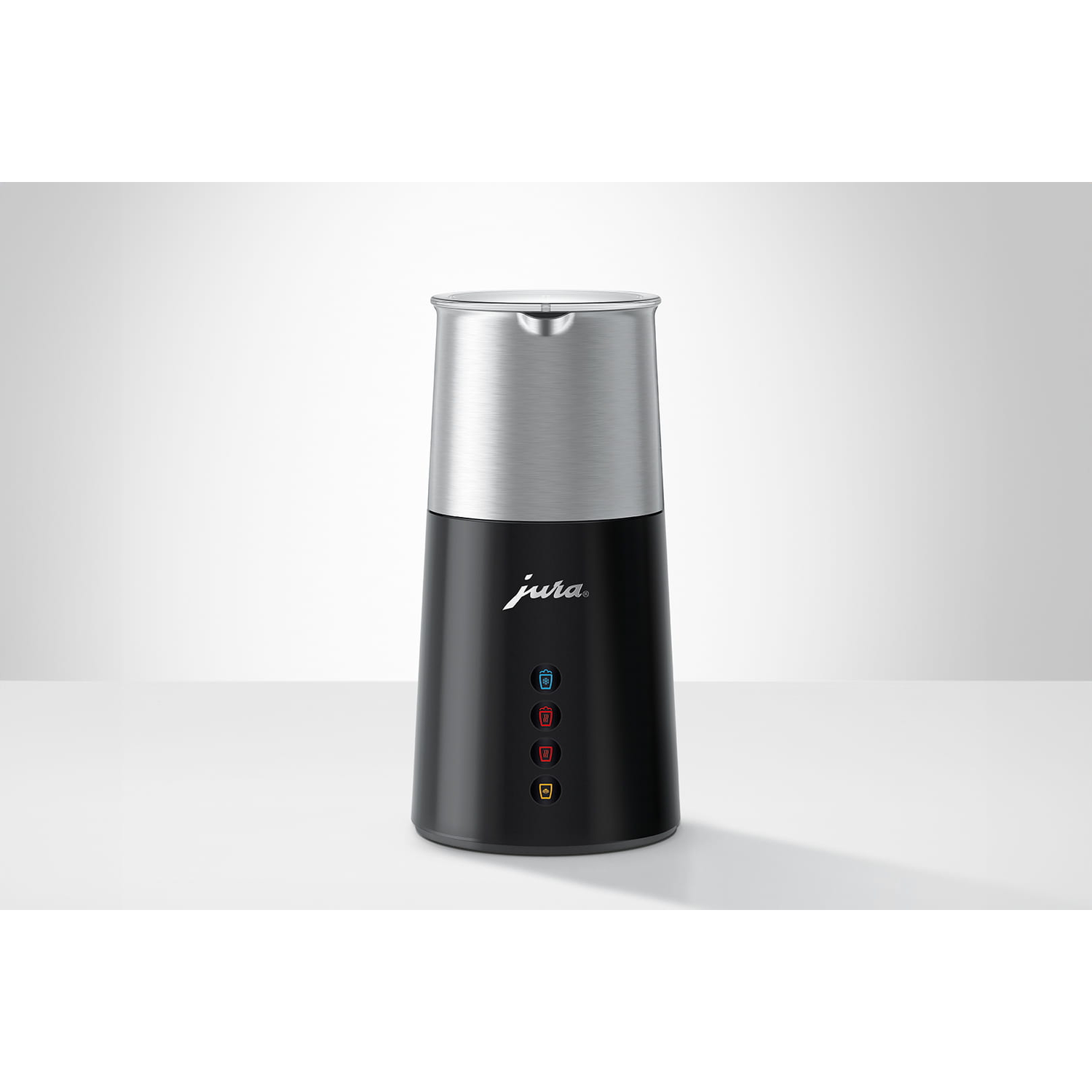 A black and silver Jura milk frother. It has a silver top and a black base with buttons. The Jura logo is visible.
