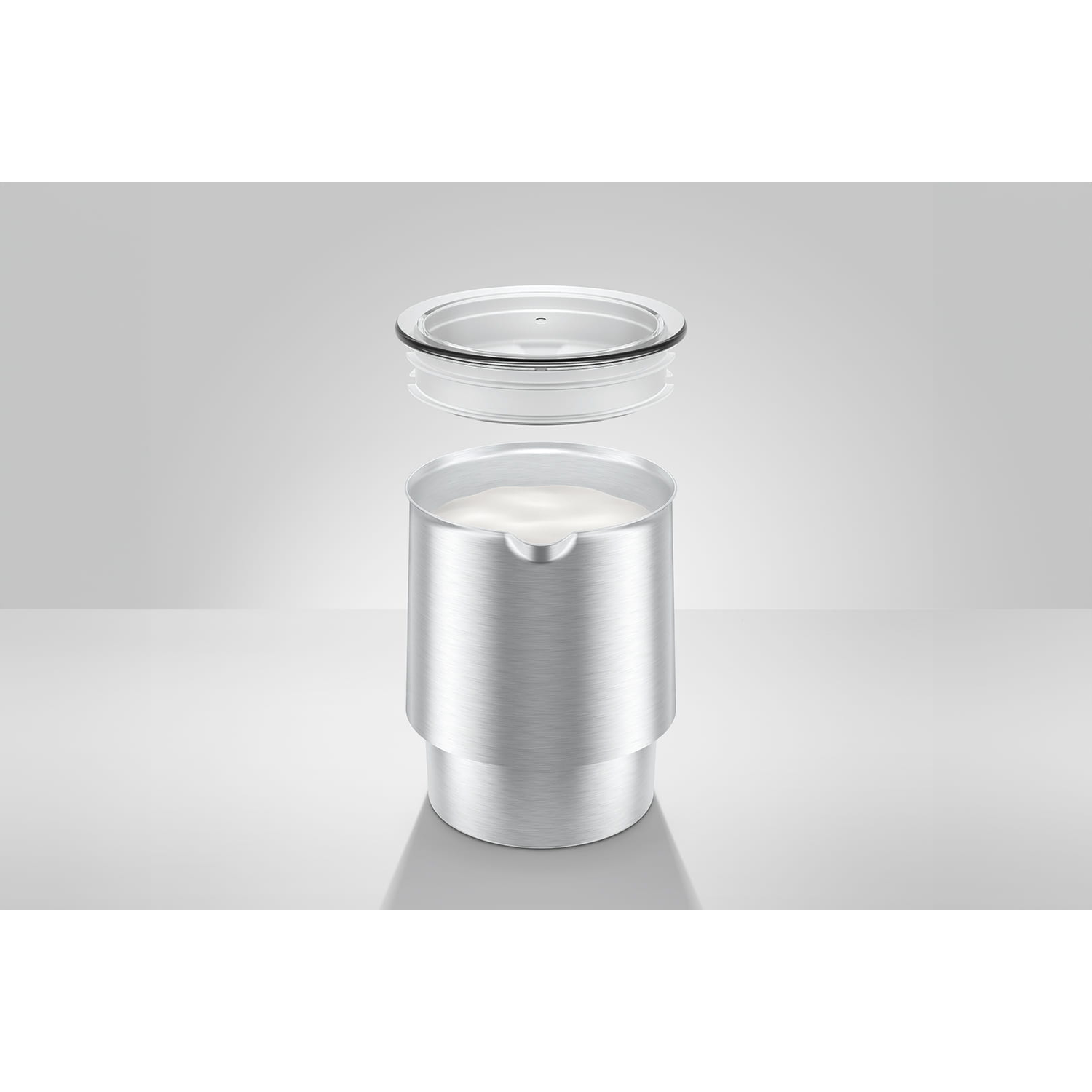 A metallic container with a clear lid, slightly open. The container is filled with a white substance. The background is a gradient of grey.
