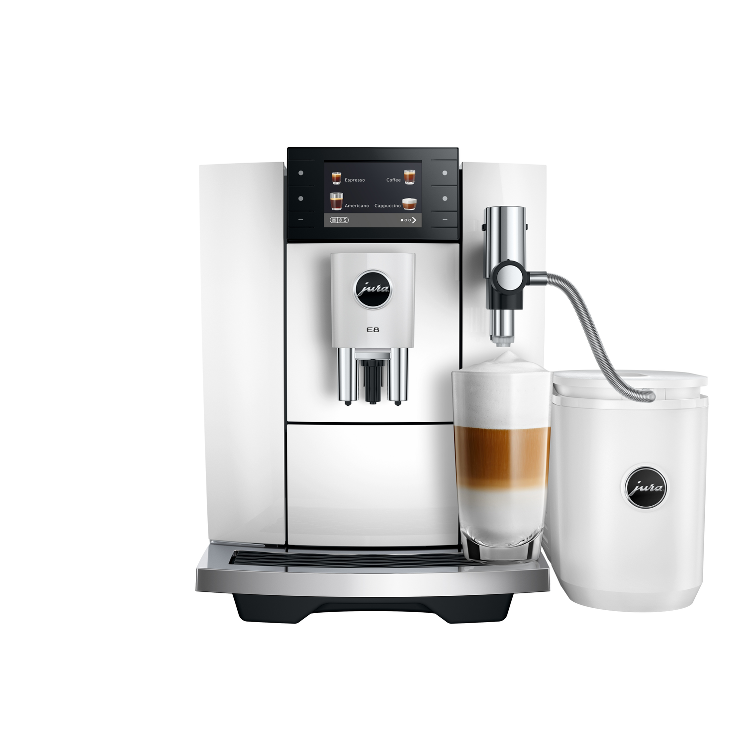 White Jura E8 coffee machine, with a glass of latte macchiato and a milk container, isolated on white background.