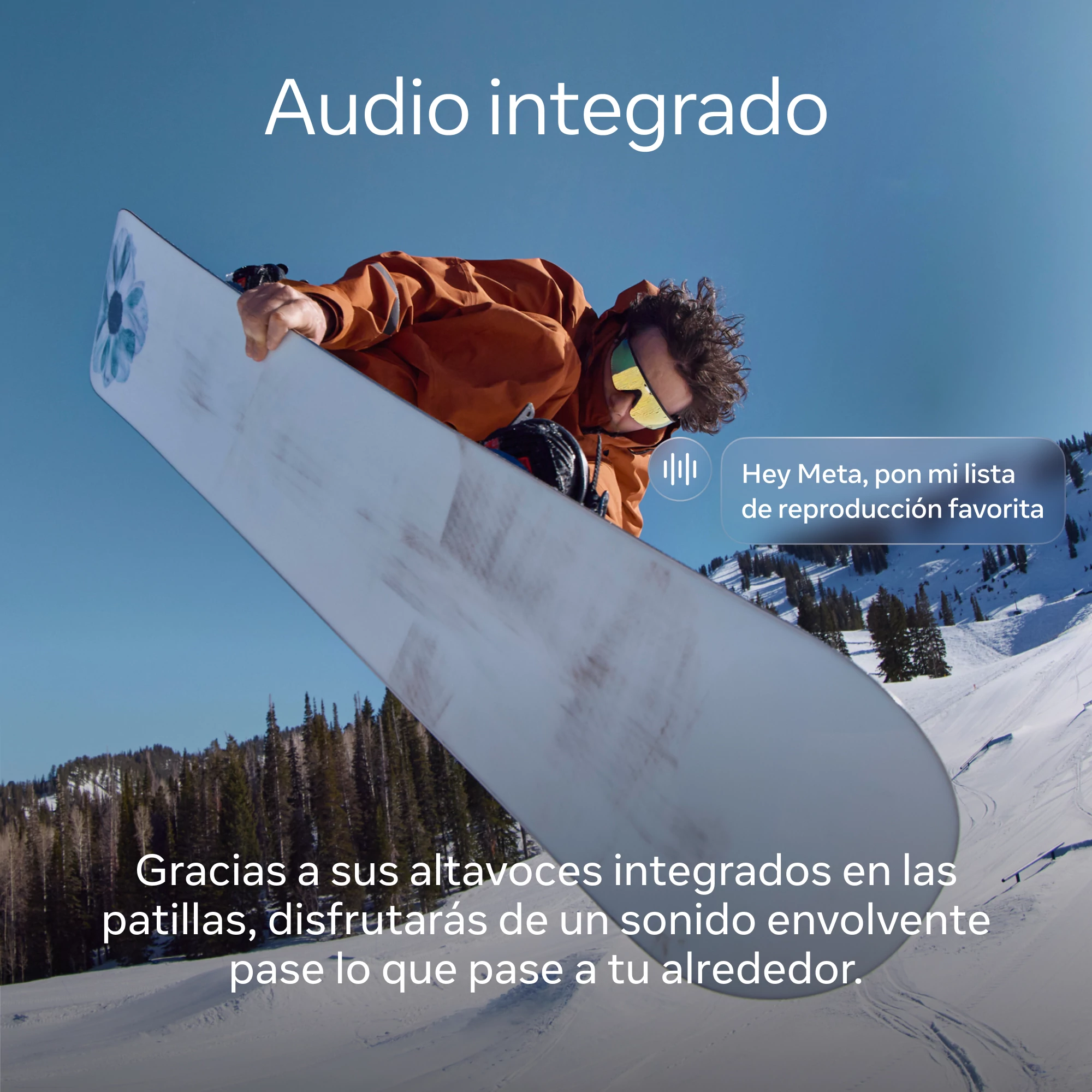 Snowboarder en el aire, sosteniendo una tabla. Texto: Audio integrado. Fondo: montaña nevada, árboles, cielo azul.