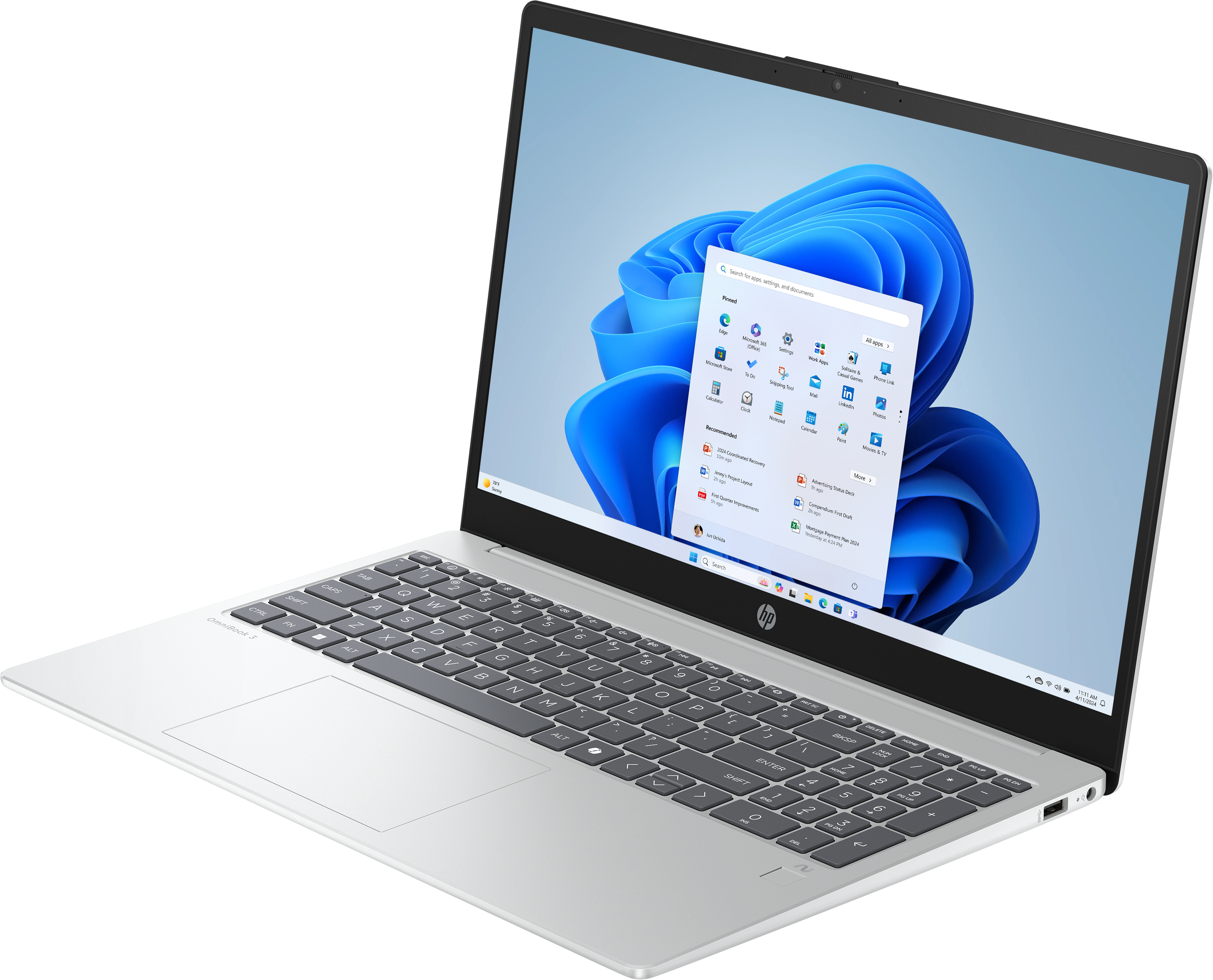 Silberner Laptop mit Windows 11. Tastatur und App-Symbole sichtbar. HP-Logo unten.