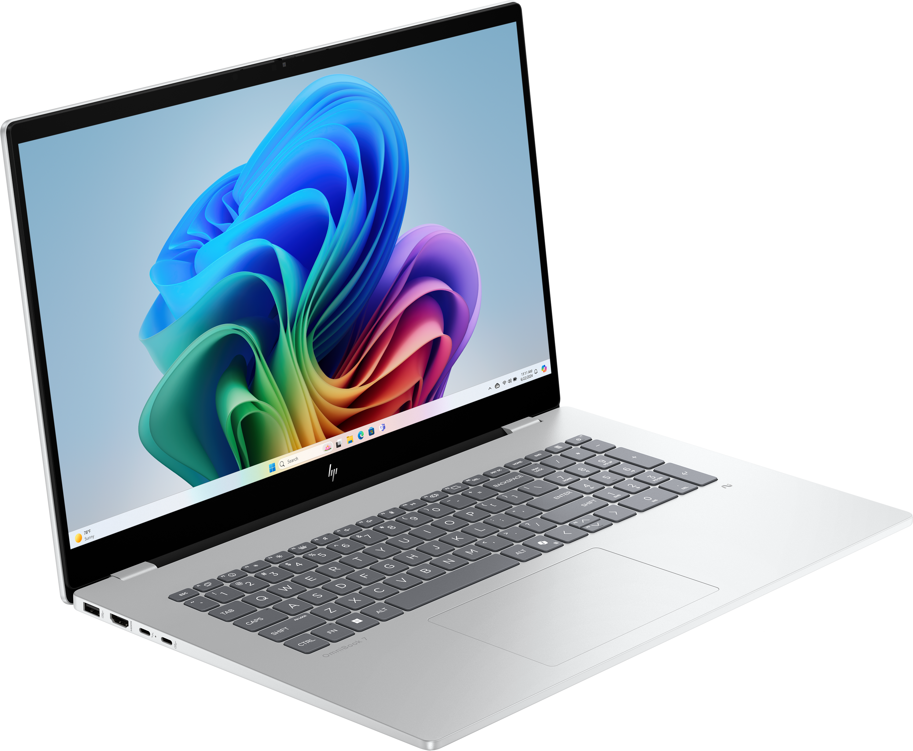 Laptop argentato mostra immagine astratta colorata. Tastiera visibile. Sfondo nero.