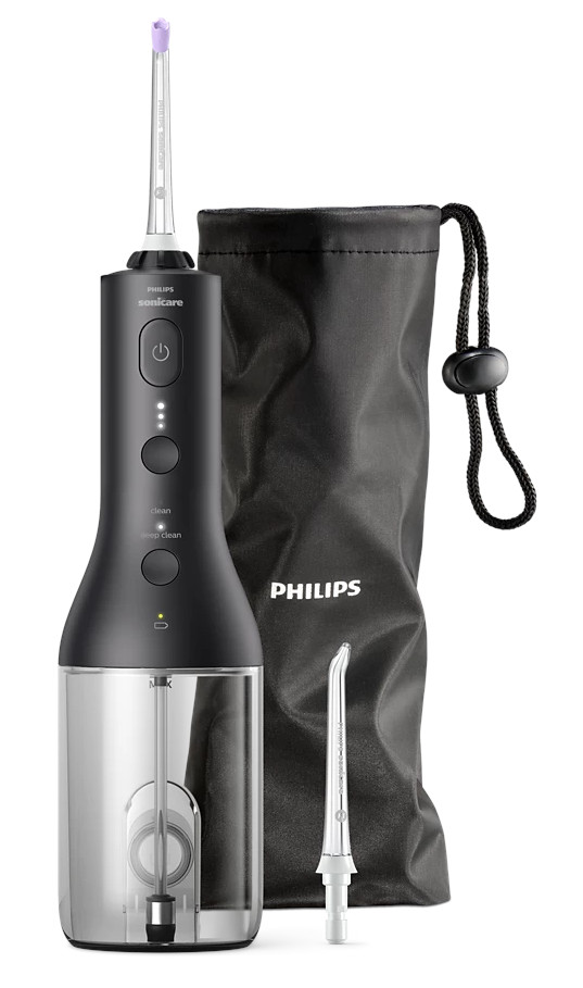 Irigator do jamy ustnej Philips Sonicare z akcesoriami: czarna torba i zapasowa dysza, na białym tle.