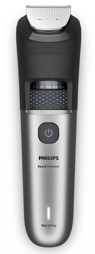 Trymer do brody Philips. Jest czarny i srebrny. Ma przycisk zasilania, ustawienia i ostrze na górze.