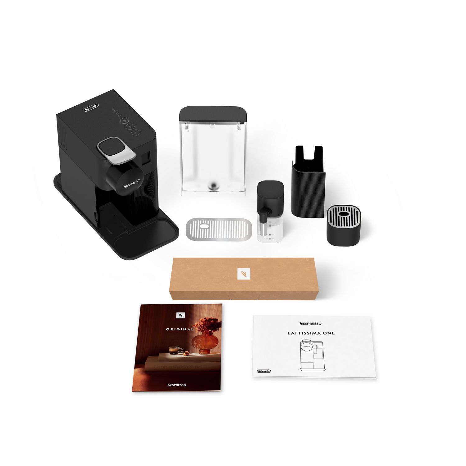 Una cafetera Nespresso Lattissima One negra y accesorios están sobre una superficie blanca, incluyendo una caja y manuales.