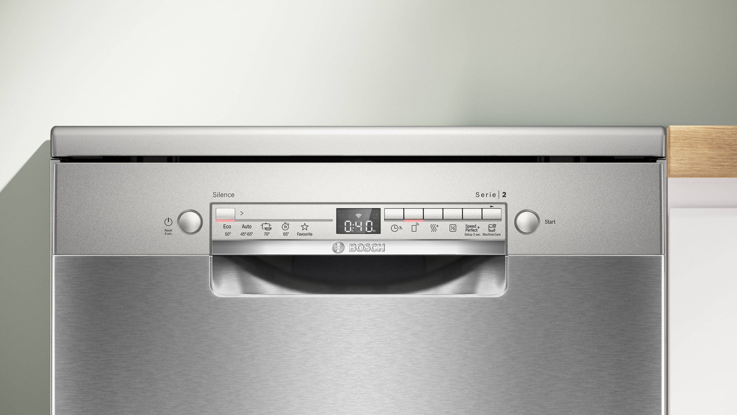 Een roestvrijstalen Bosch Serie 2 vaatwasser. Het heeft een digitaal display met timer. Verschillende bedieningsknoppen zijn zichtbaar.