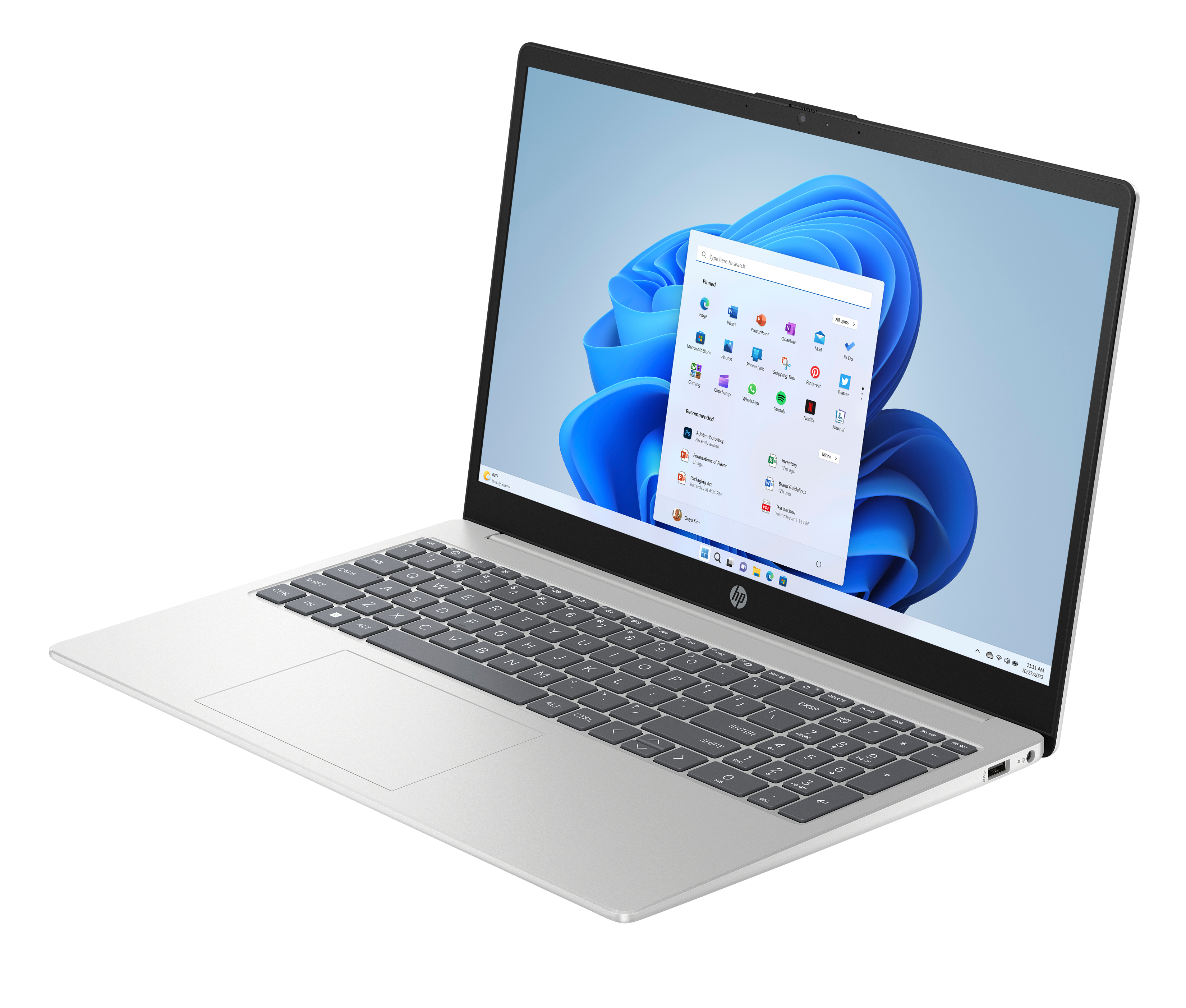 Srebrny laptop z ekranem Windows 11, widoczna klawiatura. Tło jest czarne.