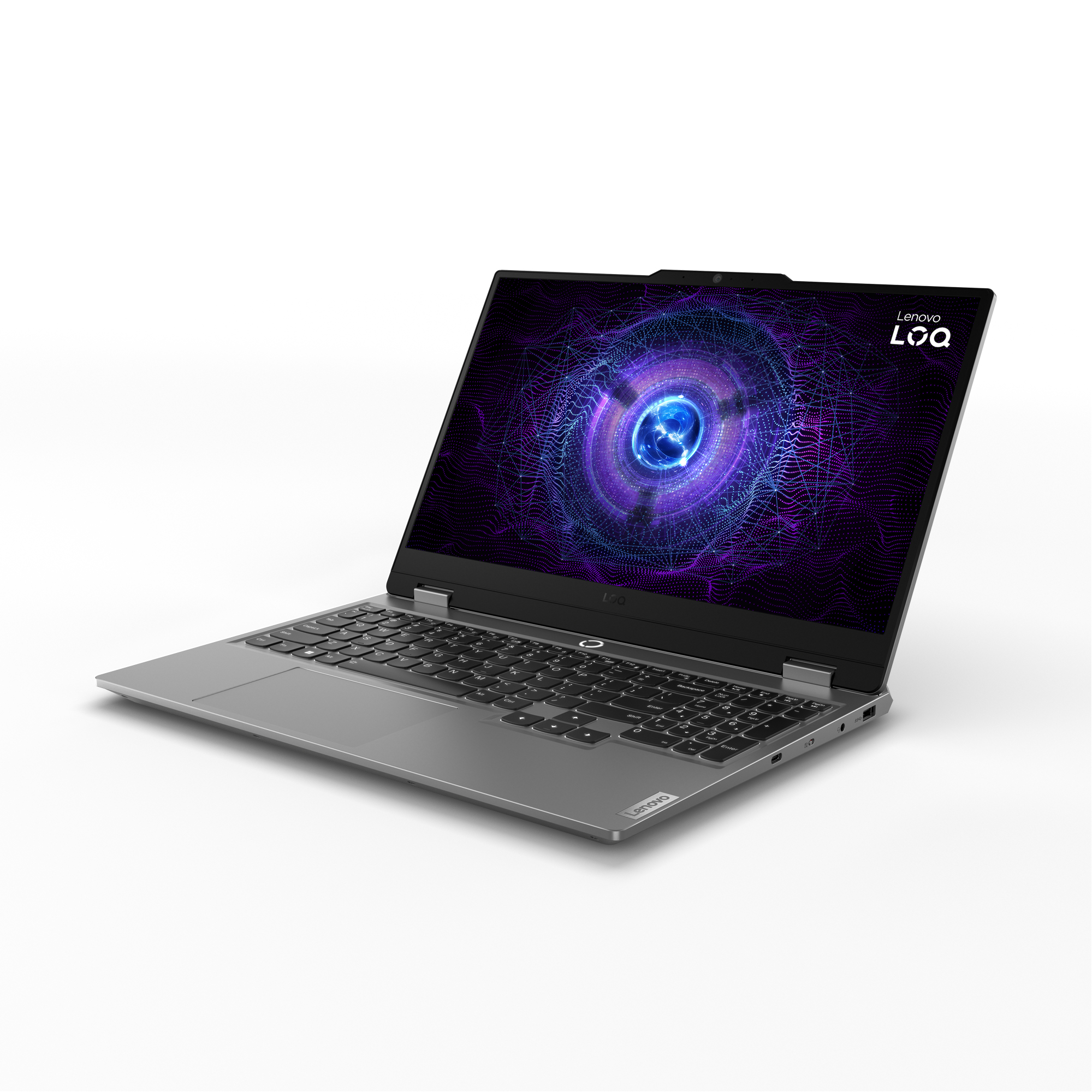 Un portátil Lenovo LOQ abierto, mostrando un diseño abstracto púrpura y azul. El teclado es visible. Superficie gris, fondo blanco.