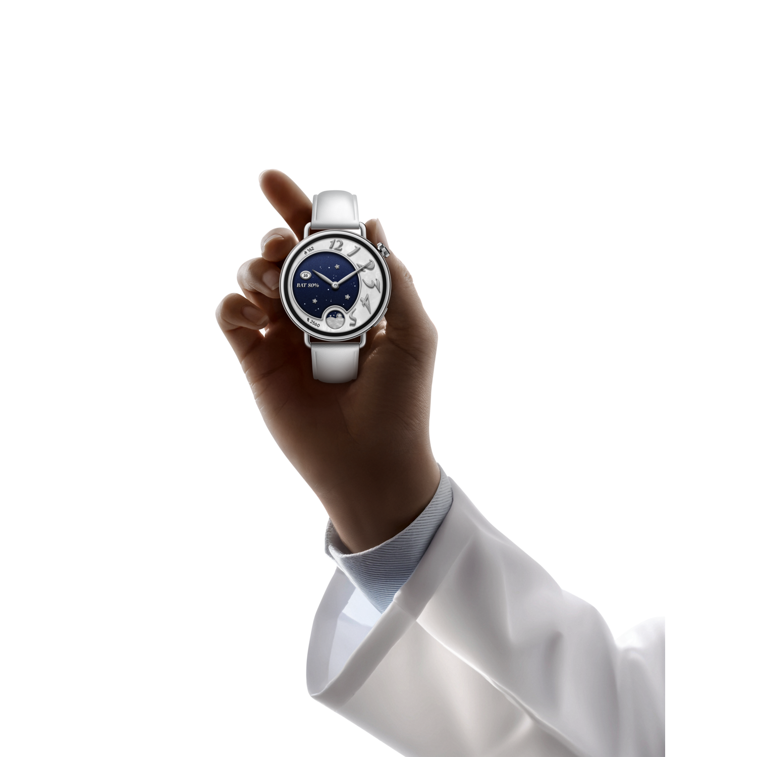 A hand holding a white strap watch with a dark blue face, with white numbers, silver frame, and a white sleeve and coat.