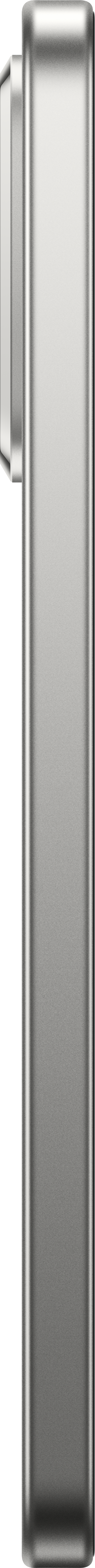 Ein vertikales, silbernes, rechteckiges Objekt mit einem kleineren, angebrachten, rechteckigen Teil. Schwarzer Hintergrund.