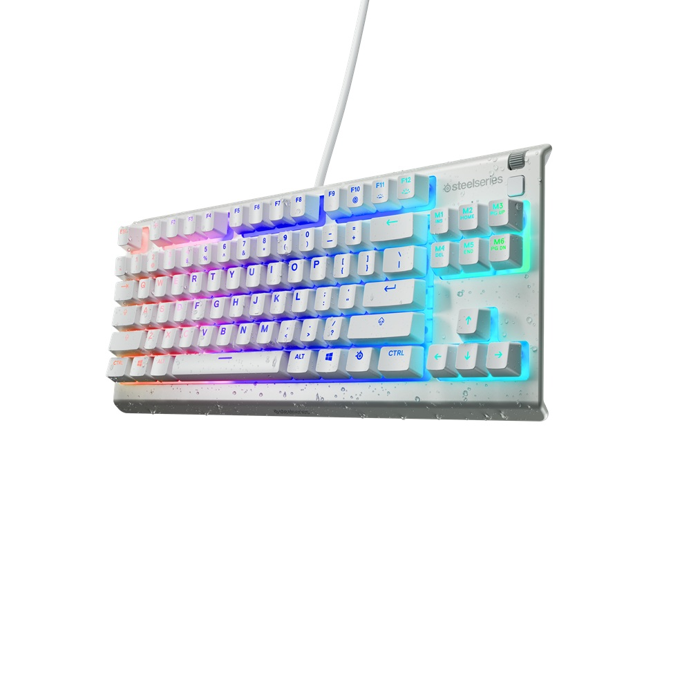 Aydınlatmalı tuşlara sahip beyaz bir SteelSeries klavye. Tuşlar standart bir düzende düzenlenmiştir. Arka plan beyazdır.