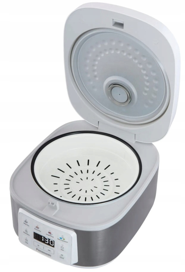 Otwarty garnek do ryżu Panasonic, pokazujący wewnętrzny garnek z otworami parowymi. Pokrywa jest uniesiona. Panel sterowania wyświetla '1:30'.