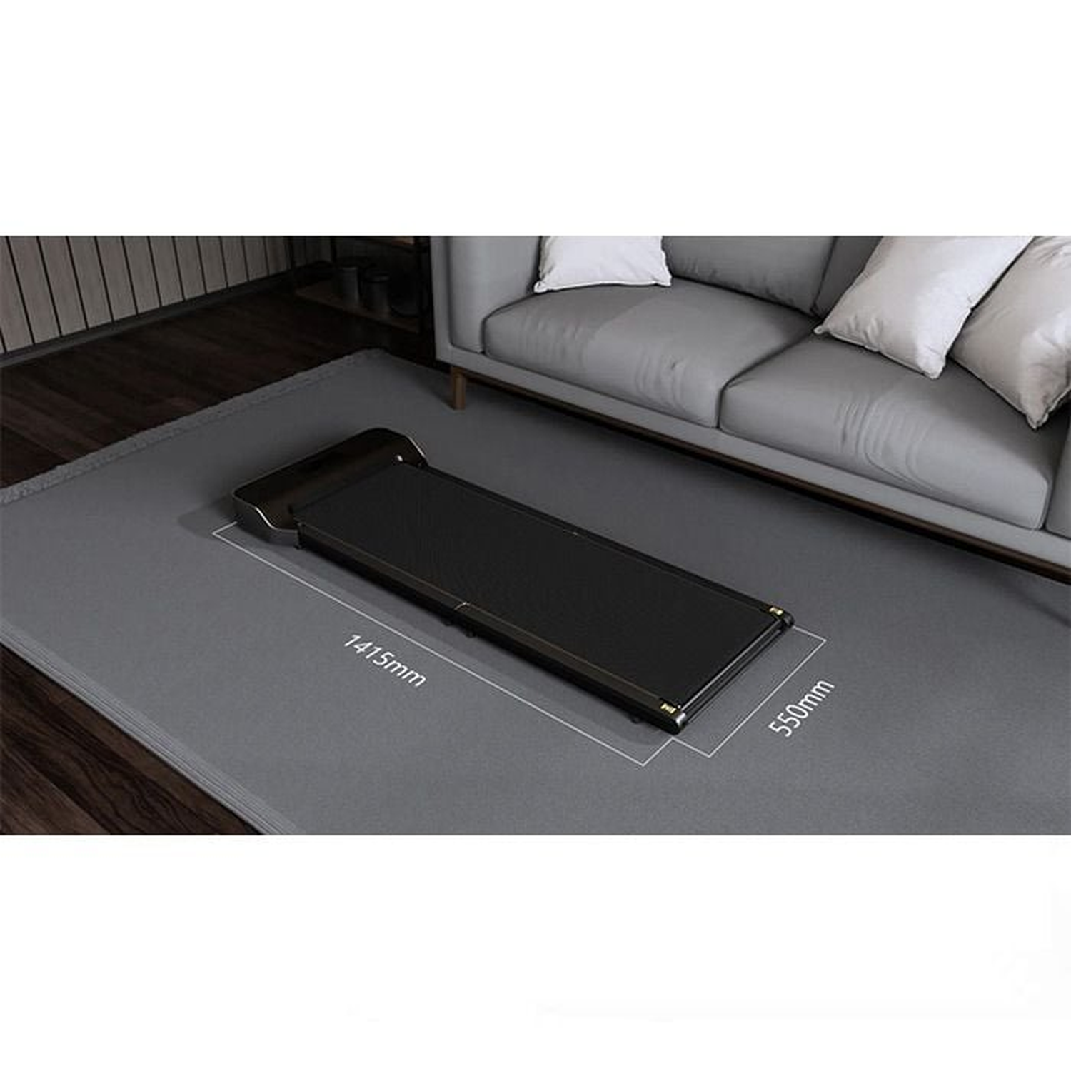 A black treadmill on a gray mat in front of a gray sofa with white pillows. Dimensions are marked on the mat.