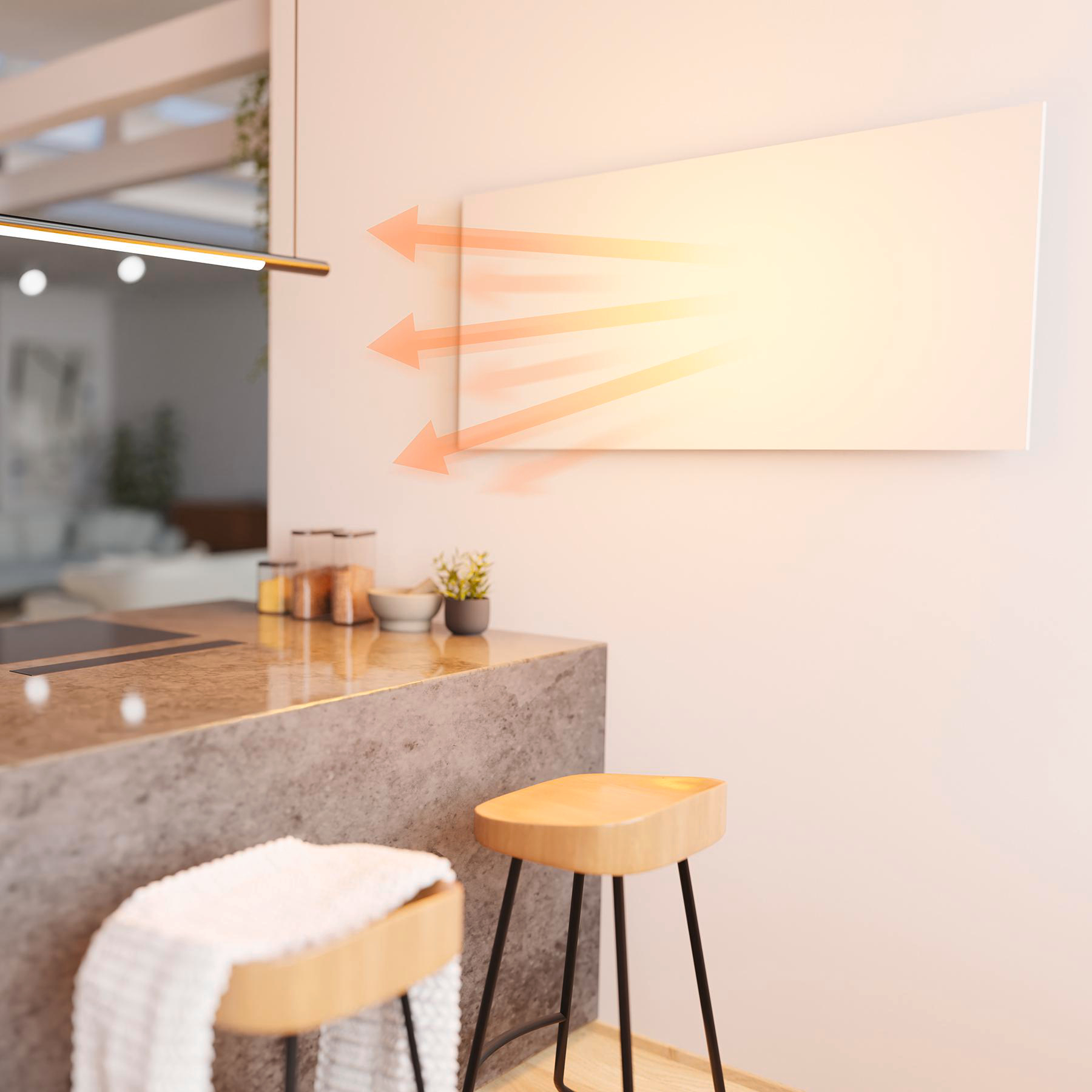 Eine weiße Heizplatte an einer Wand strahlt orangefarbene Wärme-Pfeile aus. Hocker, Arbeitsplatte und Küchenutensilien im Vordergrund.