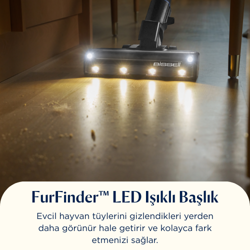 Ahşap zemini aydınlatan LED ışıklı elektrikli süpürge başlığı. Zemin üzerinde dağınık kalıntılar var.