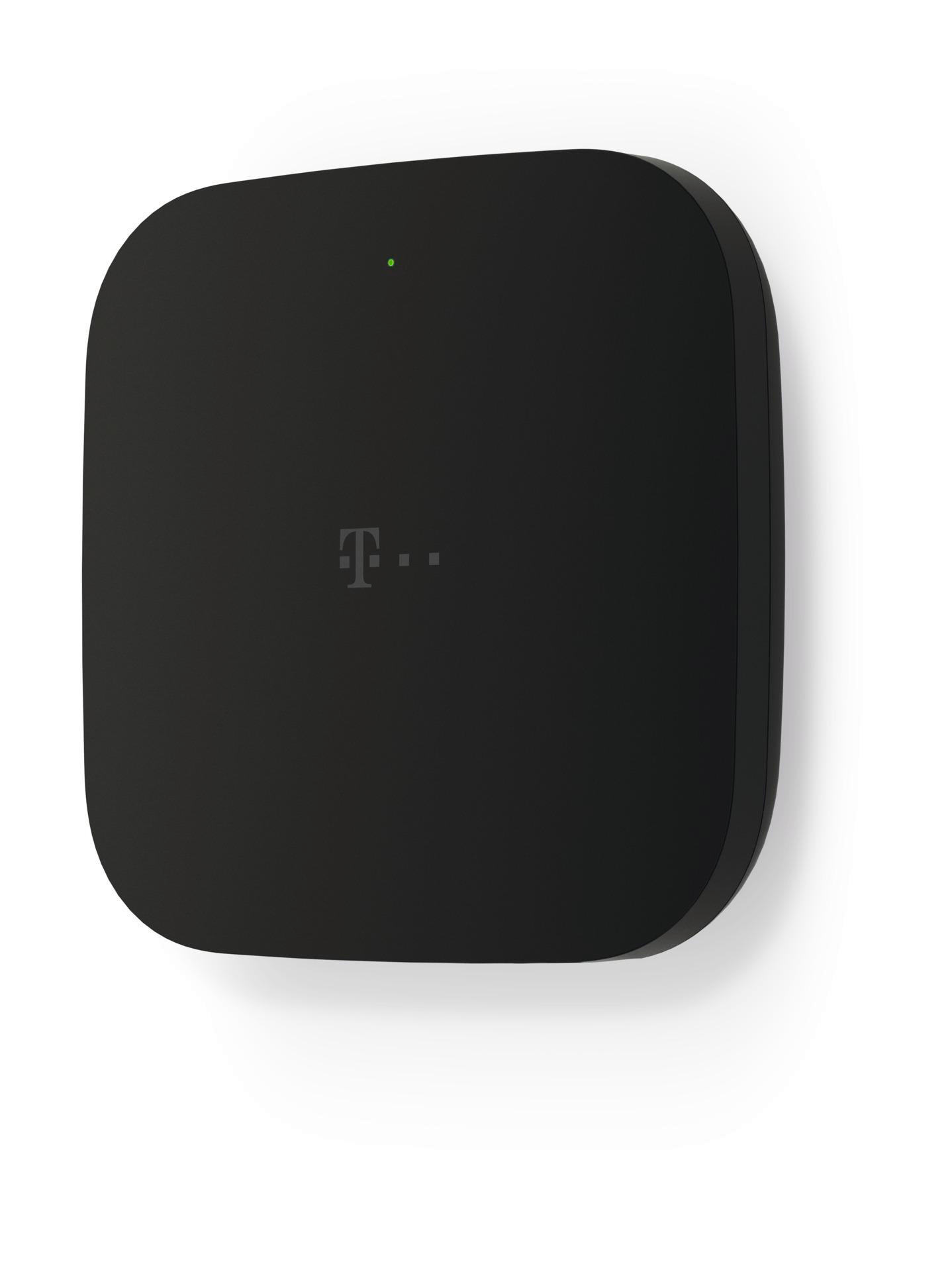 Ein schwarzes, abgerundetes quadratisches Gerät mit dem T-Mobile-Logo und einer grünen Kontrollleuchte, vor weißem Hintergrund.