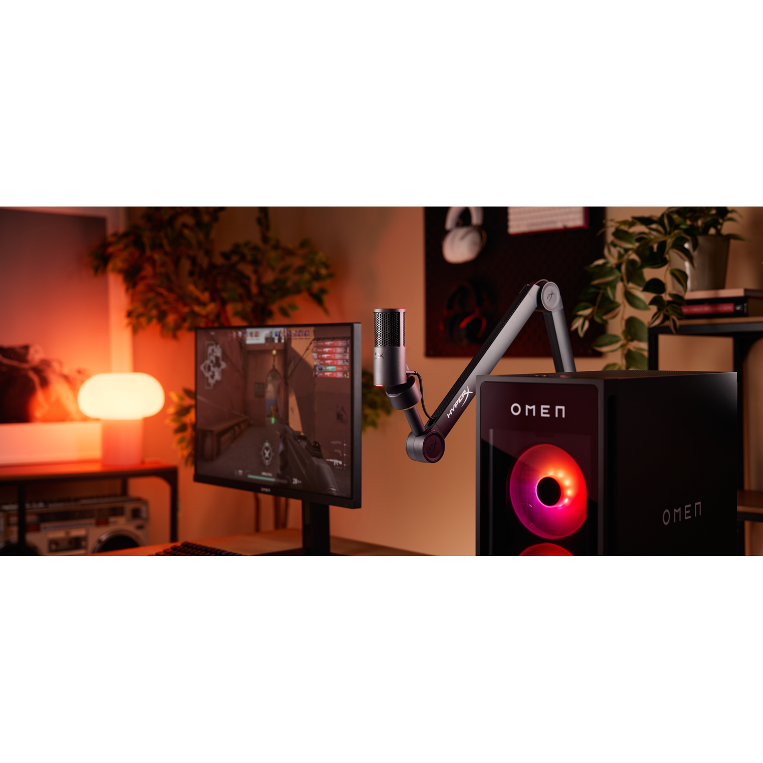 A gaming PC setup with a monitor displaying a game, a microphone, and Omen branding. Soft lighting creates a warm ambiance.