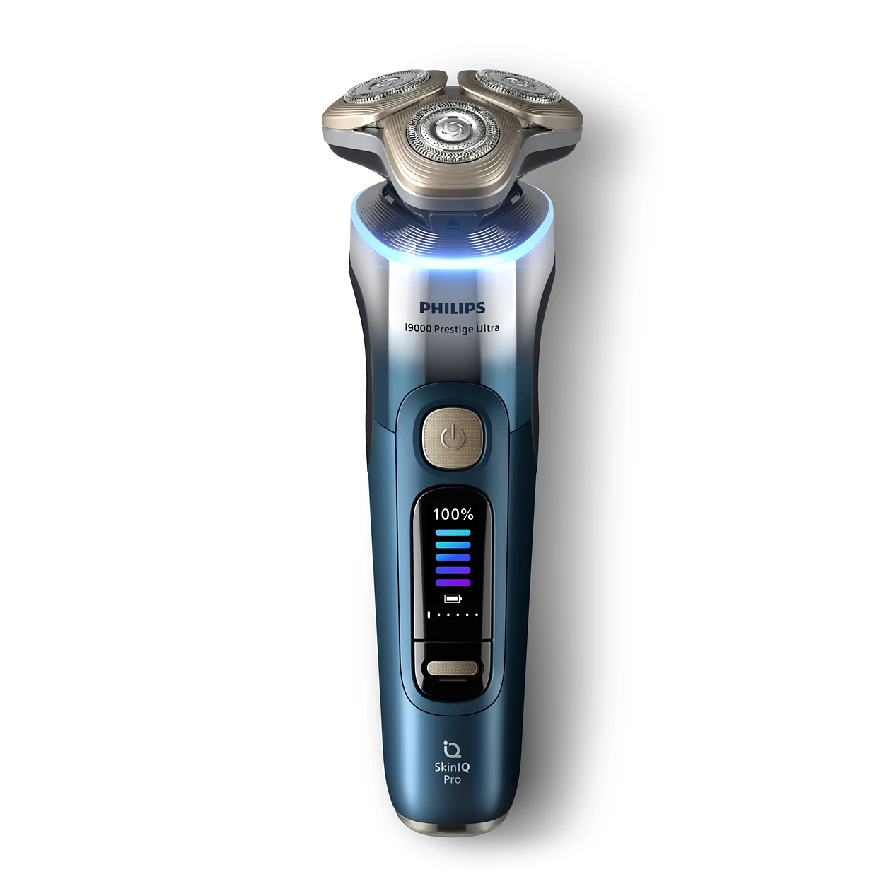 Egy Philips i9000 Prestige Ultra elektromos borotva. Kék és ezüst színű, digitális kijelzővel, amely az akkumulátor élettartamát és a SkinIQ Pro logót mutatja.