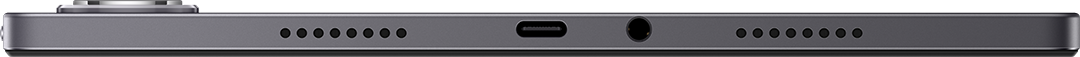 Egy táblagép alsó szélének közeli képe. USB-C porttal, fejhallgató-csatlakozóval és hangszóró lyukakkal rendelkezik.