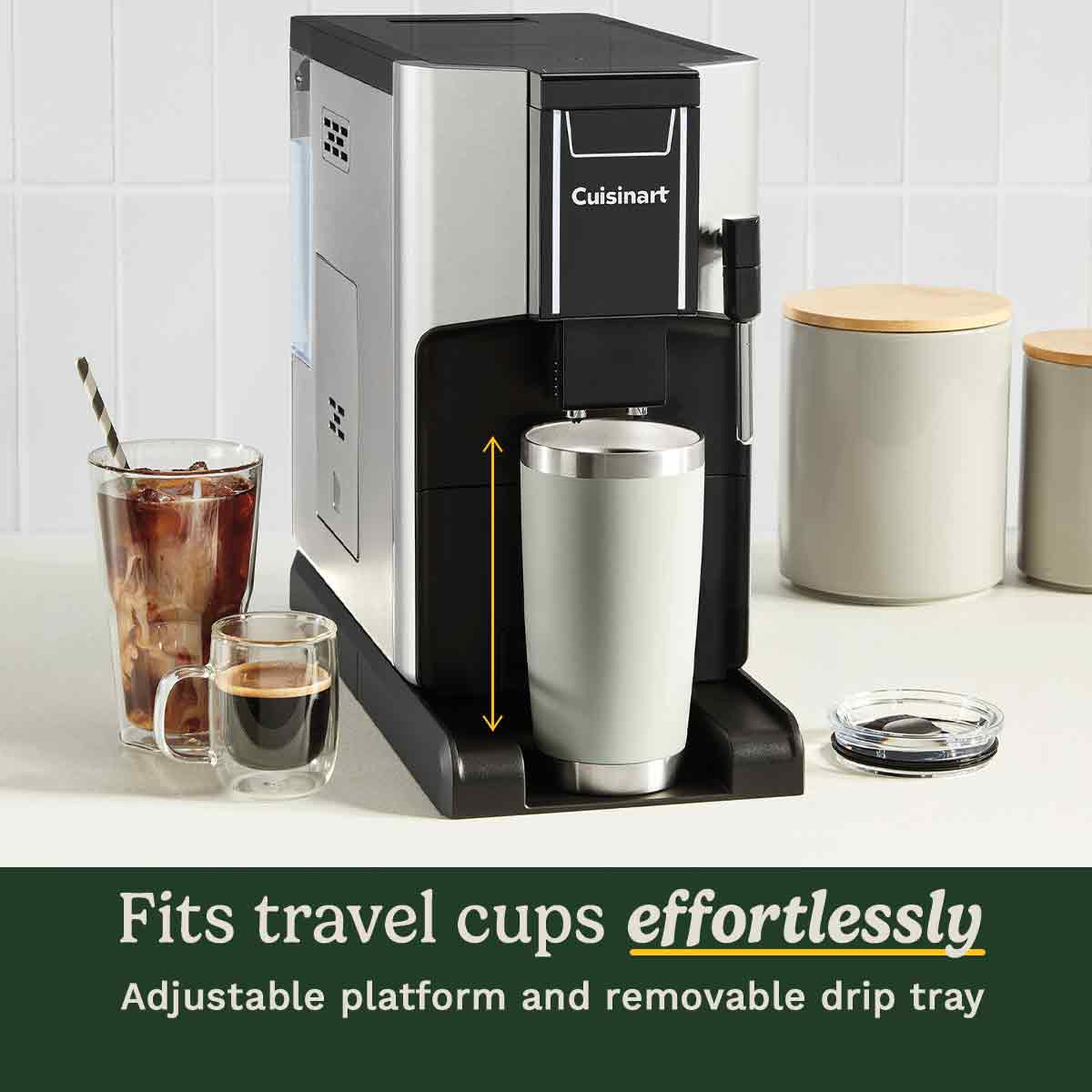 A Cuisinart coffee maker with a travel mug, two other cups of coffee, and two canisters with wooden lids.