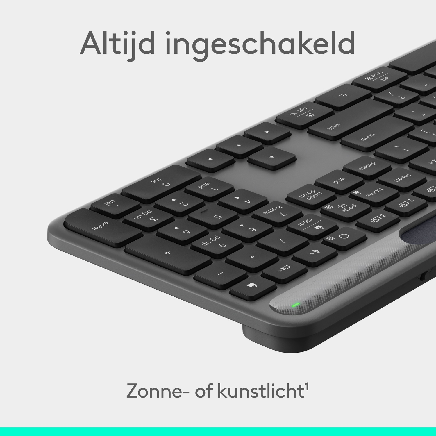 A close-up of a gray keyboard with black keys. The keyboard is angled, and the text 'Altijd ingeschakeld' is at the top.