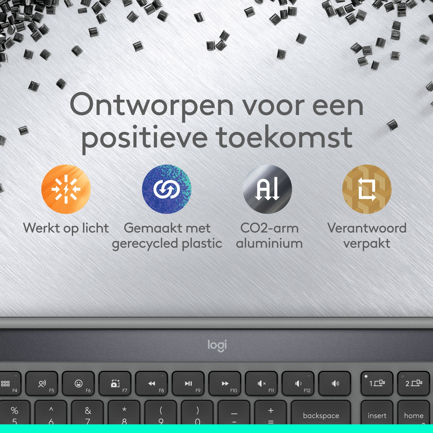 Image shows a keyboard with text about sustainable design. Includes icons and text about light, recycled plastic, and aluminum.