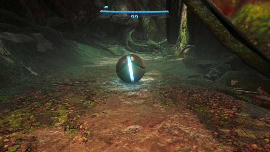 Świecąca kula na leśnej podłodze, nad nią pasek zdrowia. Scena jest słabo oświetlona.