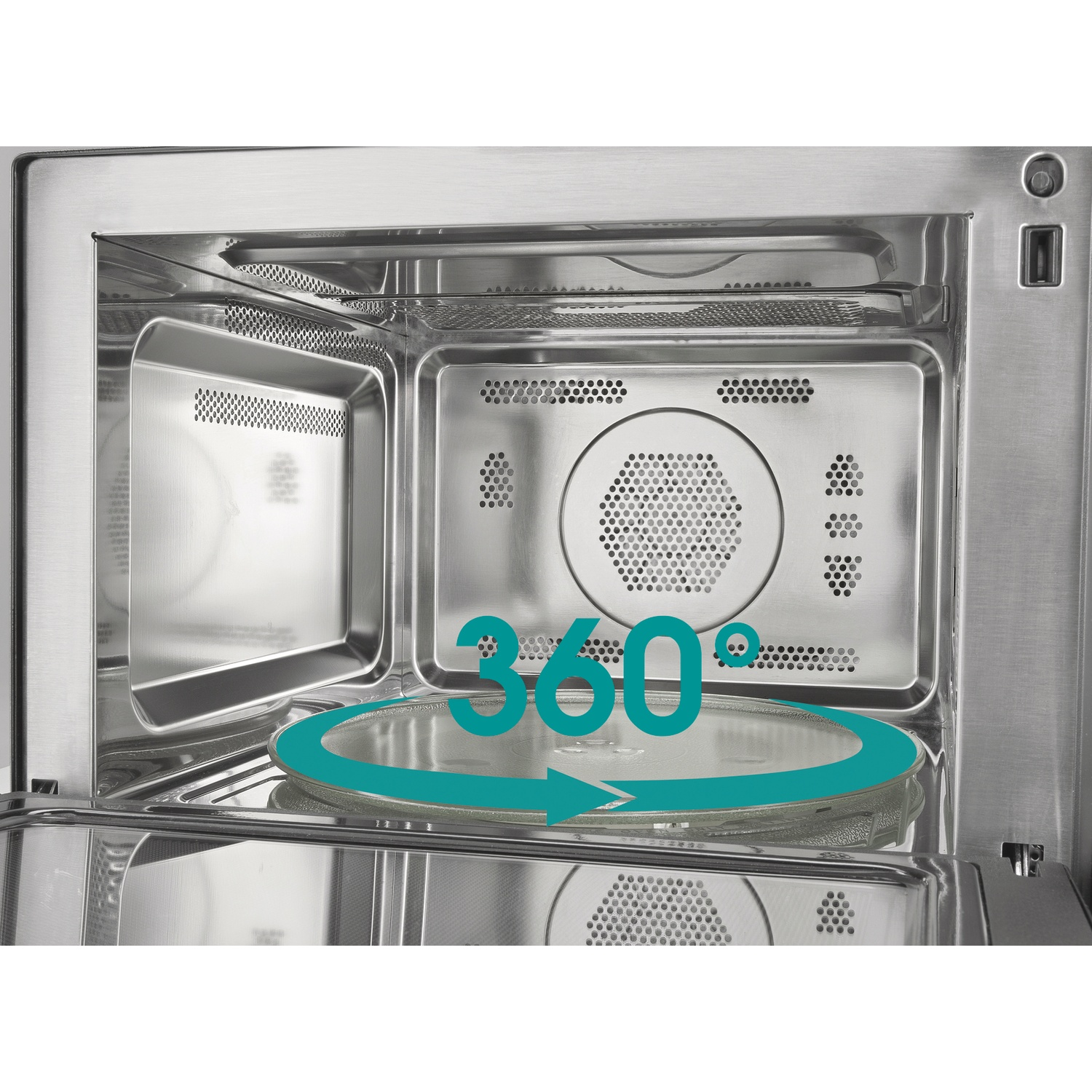 All'interno di un forno a microonde in acciaio inossidabile. Un piatto di vetro si trova sul fondo. Viene visualizzata una grafica a freccia turchese a 360 gradi.
