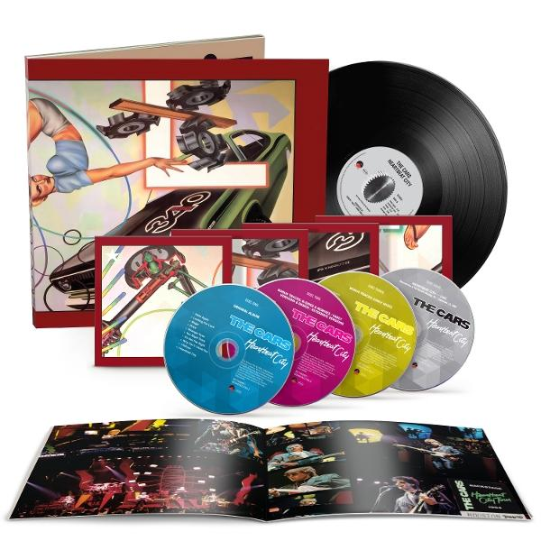Albumcover mit Frau, Auto und CDs. Schallplatte und offenes Booklet. Das Album ist 'Heartbeat City' von The Cars.